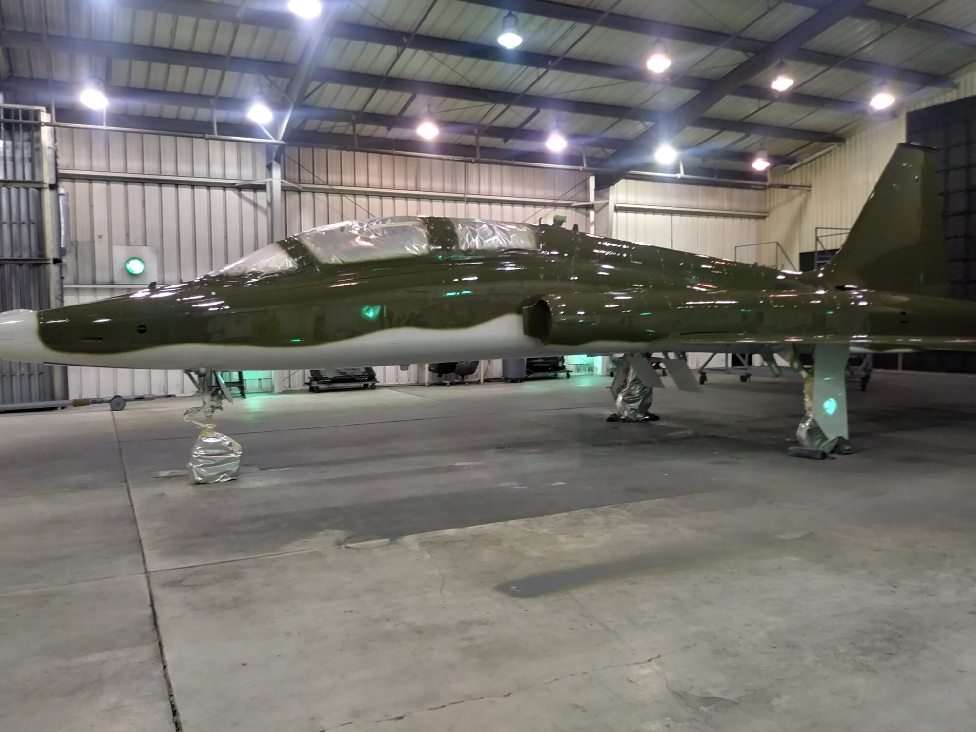 A T-38 Talon assigned to the 586th Flight Test Squadron sits in the paint barn after it’s been stripped. It awaits its new colors. The 586th Flight Test Squadron is repainting this T-38 in honor of their World War II namesake, the 586th Bombardment Squadron. (U.S. Air Force photo by Dwight Harp)