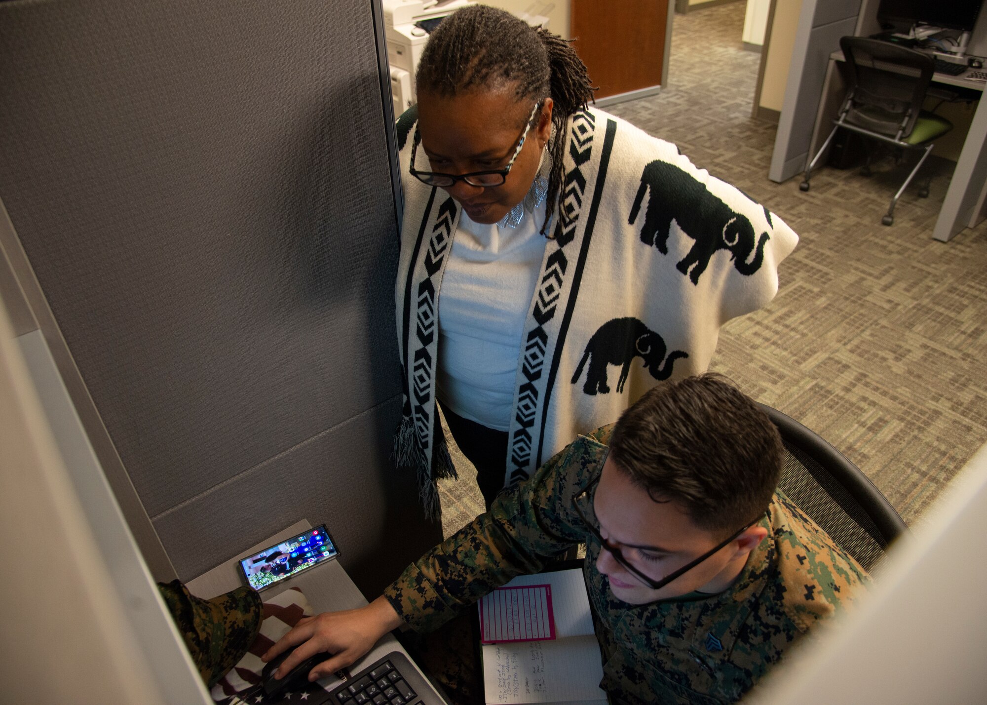 Angie Fields, a community readiness consultant at the Military and Family Readiness Center (MFRC) assists a U.S. Marine Sergeant Federico Garciacruz, an admin specialist at Special Operations Command Central, Jan. 22, 2020 at MacDill Air Force Base, Fla. The MFRC offers military members assistance with a large variety of financial and career-based guidance.