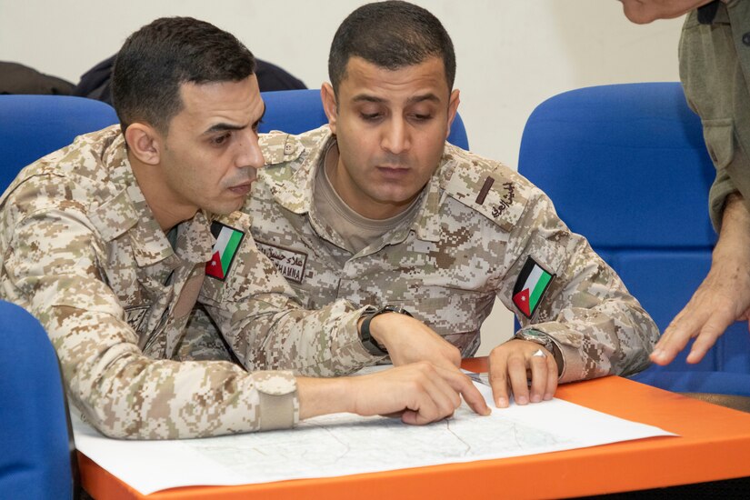 Jordan Armed Forces-Arab Army (JAF) Soldiers identify terrain features during a Map Reading Subject Matter Expert Exchange with Military Engagement Team-Jordan, 158th Maneuver Enhancement Brigade, Arizona Army National Guard, at a base outside of Amman, Jordan Jan. 13, 2020. The United States will protect our people and interests anywhere they are found around the world and is committed to the security of Jordan and to the partnering closely with the JAF to meet common security challenges. (U.S. Army photo by Sgt. 1st Class Shaiyla B. Hakeem)