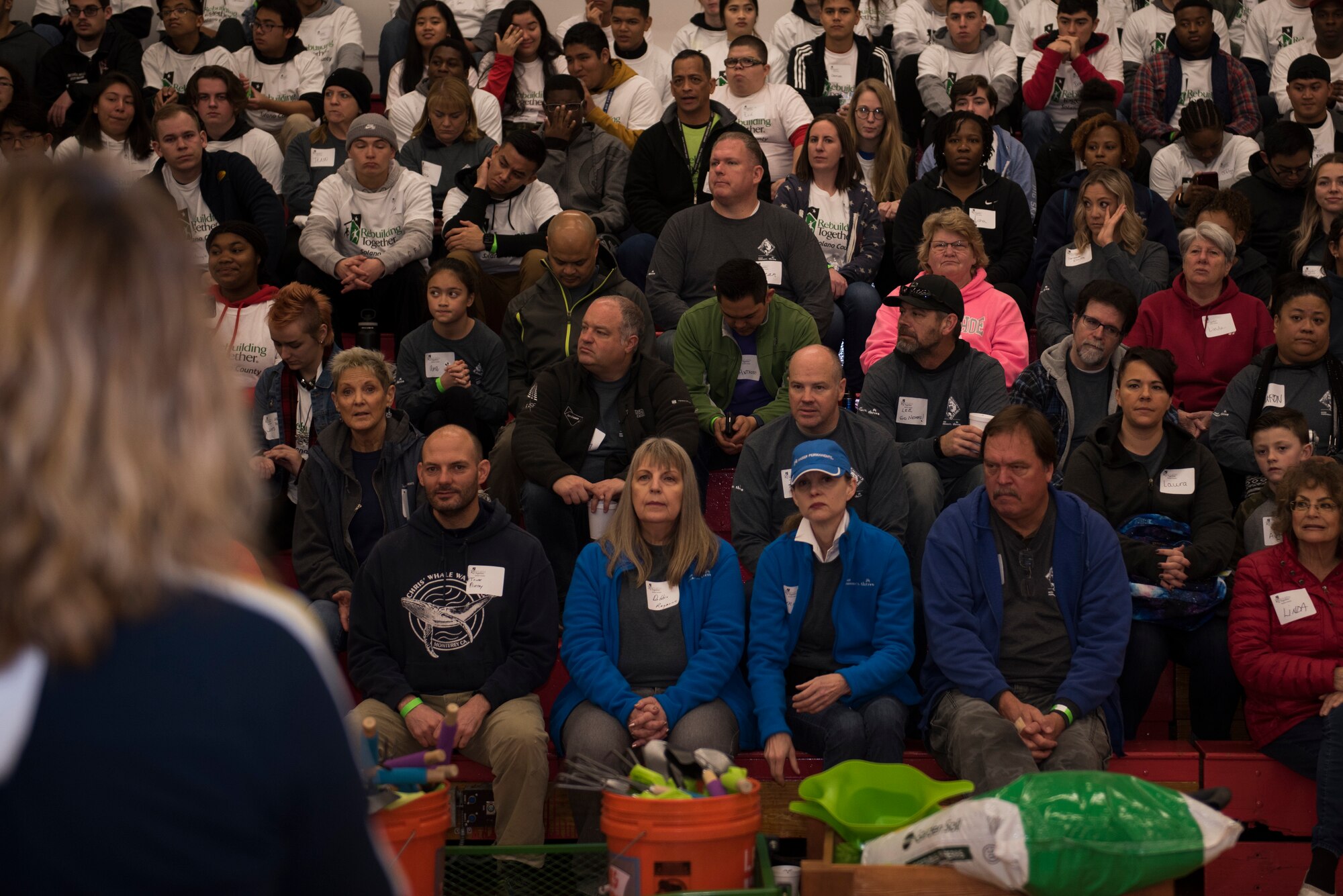 Elizabeth Hoffman, Rebuilding Together Solano County executive director, speaks to Rebuilding Together Solano County volunteers, Jan. 20, 2020, at Fairfield High School, Fairfield, California. The Rebuilding Together Solano County organization hosts an annual Martin Luther King Jr. Day of Service event where various volunteers help rebuild the community. This year marked their 11th annual Martin Luther King Jr. Day of Service event. More than 300 workers, including 31 Travis Airmen, volunteered to make their community a better and safer place. (U.S. Air Force photo by Airman 1st Class Cameron Otte)