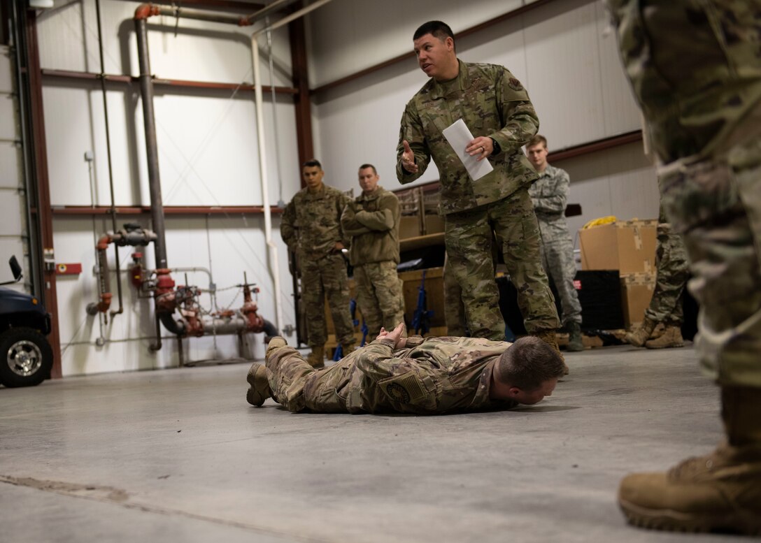 Staff Sgt. Edward Leon, 366th Civil Engineer Squadron water a fuel systems technician, trains Airmen on detaining protocols during the Base Emergency Engineer Force training, Jan. 23, 2020, at Mountain Home Air Force Base, Idaho. This training was conducted to equip Airman with skills from other career fields to enhance their readiness. (U.S. Air Force photo by Senior Airman Tyrell Hall)
