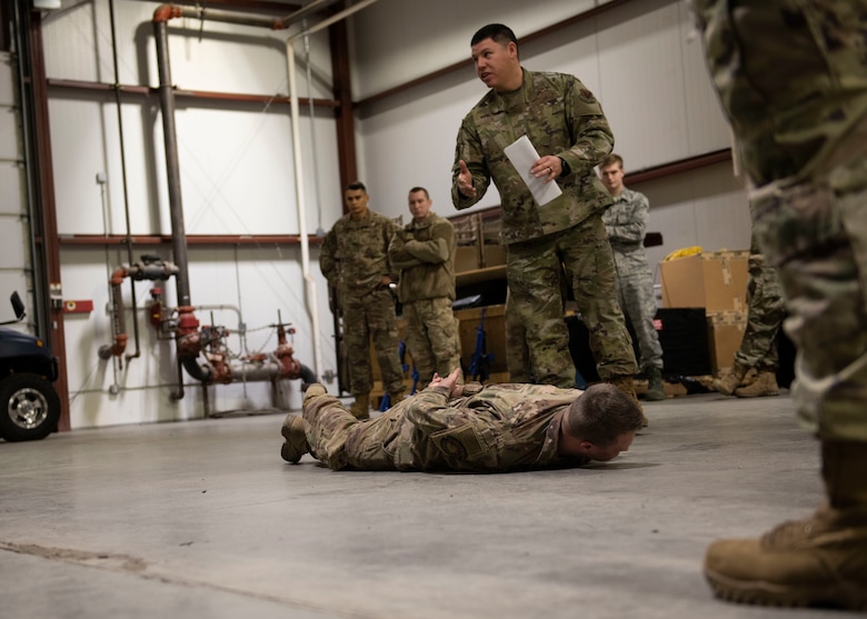 Staff Sgt. Edward Leon, 366th Civil Engineer Squadron water a fuel systems technician, trains Airmen on detaining protocols during the Base Emergency Engineer Force training, Jan. 23, 2020, at Mountain Home Air Force Base, Idaho. This training was conducted to equip Airman with skills from other career fields to enhance their readiness. (U.S. Air Force photo by Senior Airman Tyrell Hall)