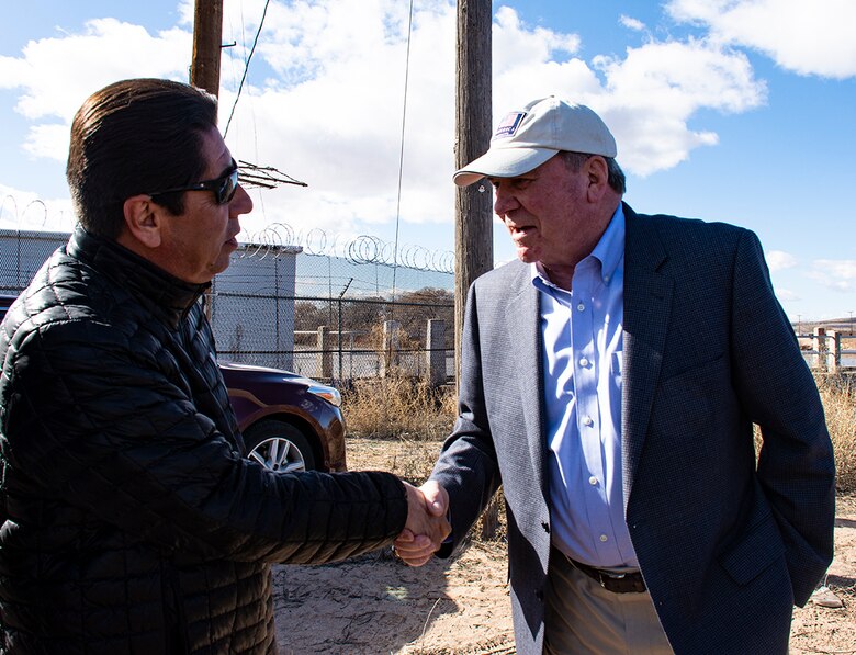 Albuquerque, N.M. -- R.D. James, assistant secretary of the Army for civil works, shakes hands with Richard Jaramillo, 2nd Lt. Gov., Pueblo of Isleta, during James' visit to U.S. Army Corps of Engineers-Albuquerque District Jan. 22.  James discussed the Middle Rio Grande Bernalillo to Belen Flood Protection project, which will protect Pueblo lands when completed.