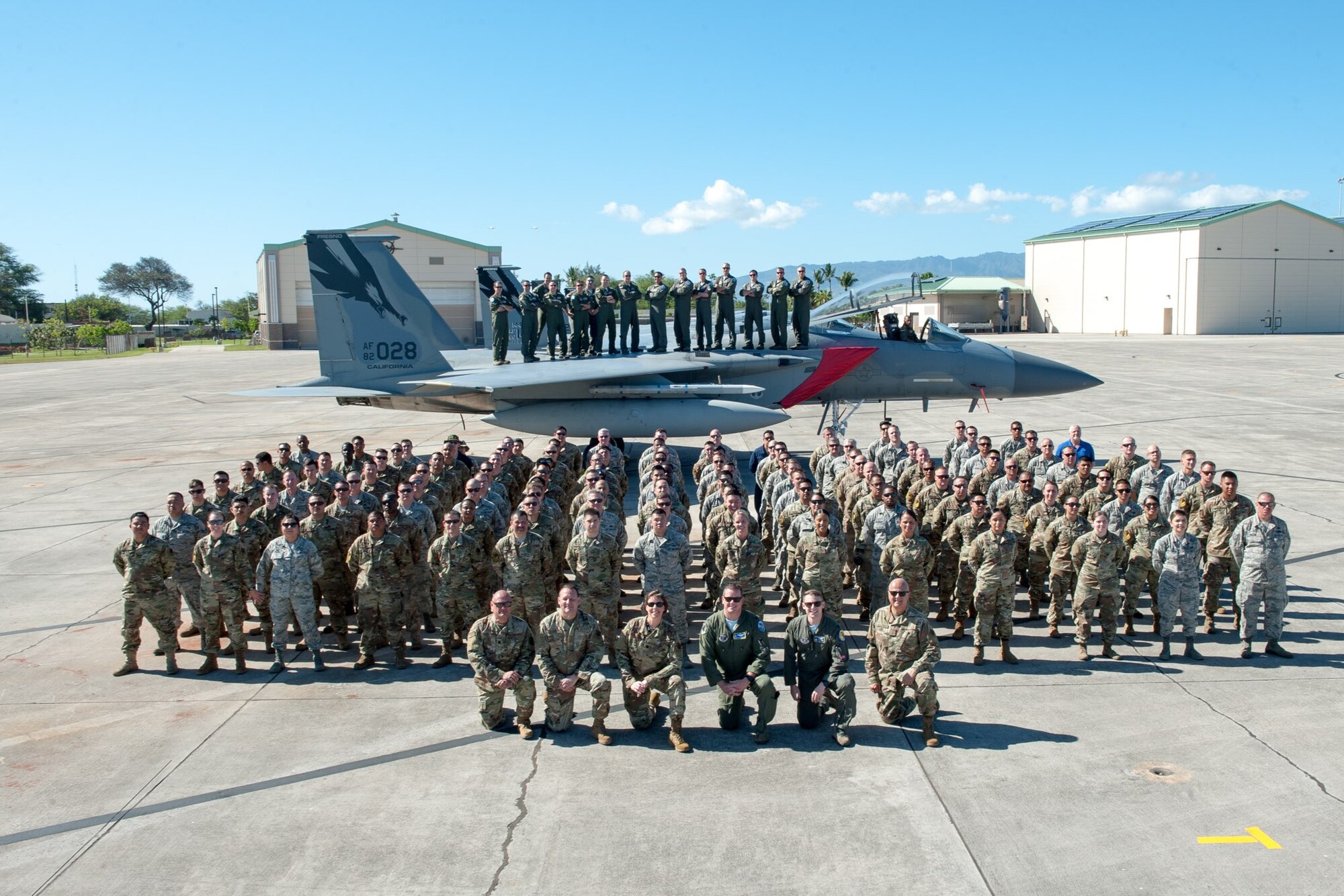 During the final day of Sentry Aloha 20-1, which is a fighter integration training exercise held at Joint Base Pearl Harbor-Hickam, Hawaii, 120 Airmen from the 144th Fighter Wing stand in formation for a group photo with an F-15C Eagle.