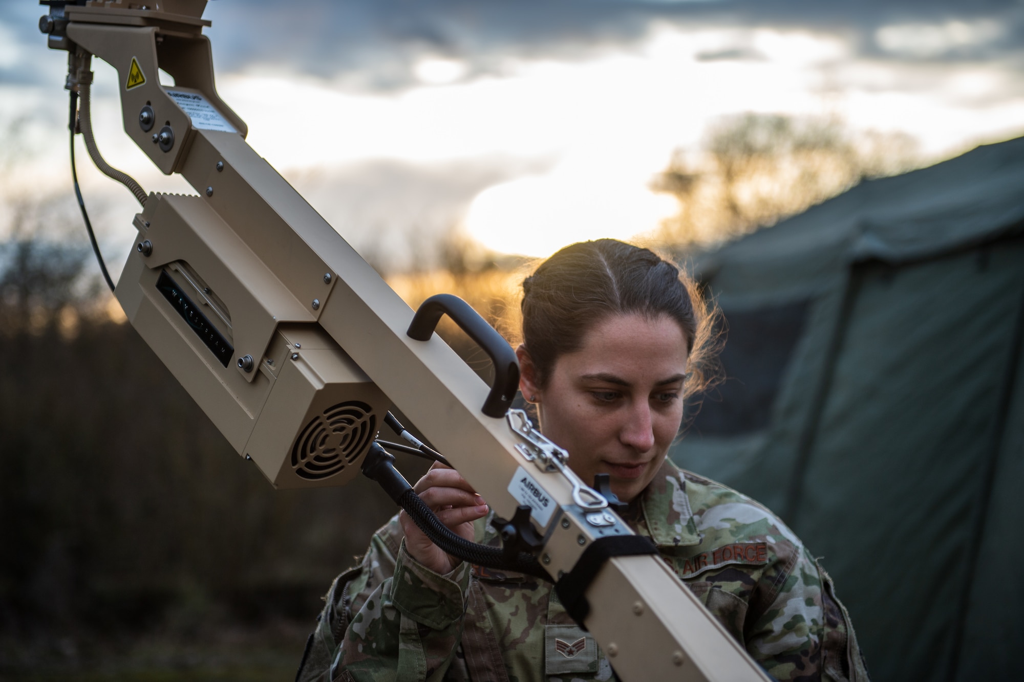 U.S. Air Force Senior Airman Taylor Earl, 1st Combat Communications Squadron cyber transport systems technician, works on a satellite dish during exercise Heavy Rain in Grostenquin, France, Jan. 15, 2020. The 1st CBCS practiced their ability to detect and counter radio frequency interference to ensure ground communications remain online. (U.S. Air Force photo by Staff Sgt. Devin Boyer)