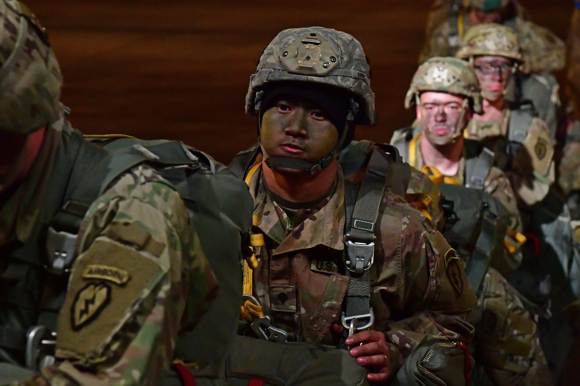 Soldiers from the 4th Brigade Combat Team (Airborne), 25th Infantry Division, at Joint Base Elmendorf-Richardson, Alaska, board a C-130J Super Hercules during the joint forcible entry and airborne assault.