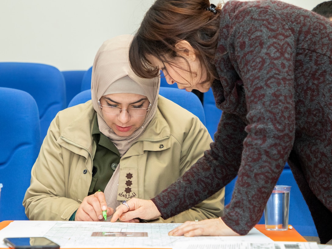 A Jordan Armed Forces-Arab Army (JAF) Quick Reaction Force Female Engagement Team Soldier examines a map scale during a Map Reading Subject Matter Expert Exchange with Military Engagement Team-Jordan, 158th Maneuver Enhancement Brigade, Arizona Army National Guard, at a base outside of Amman, Jordan Jan. 13, 2020. The United States will protect our people and interests anywhere they are found around the world and is committed to the security of Jordan and to the partnering closely with the JAF to meet common security challenges. (U.S. Army photo by Sgt. 1st Class Shaiyla B. Hakeem)