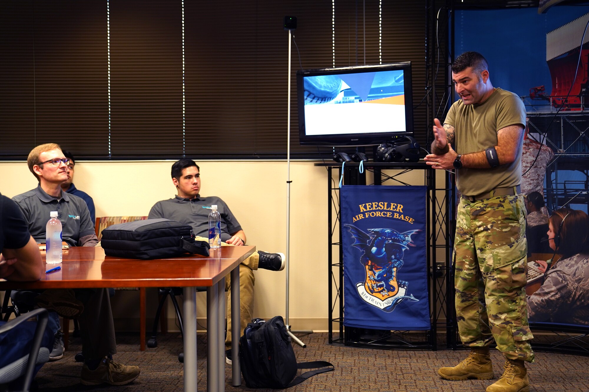 U.S. Air Force Master Sgt. Nathan Cyr, 335th Training Squadron Precision Measurement Equipment Laboratory career field training manager, provides feedback on the new virtual reality technology of the 335th TRS inside the Trainer Development Center at Keesler Air Force Base, Mississippi, Jan. 16, 2020. The 335th TRS has introduced a new VR training experience to teach the students in the PMEL career field more efficiently. (U.S. Air Force photo by Airman 1st Class Seth Haddix)
