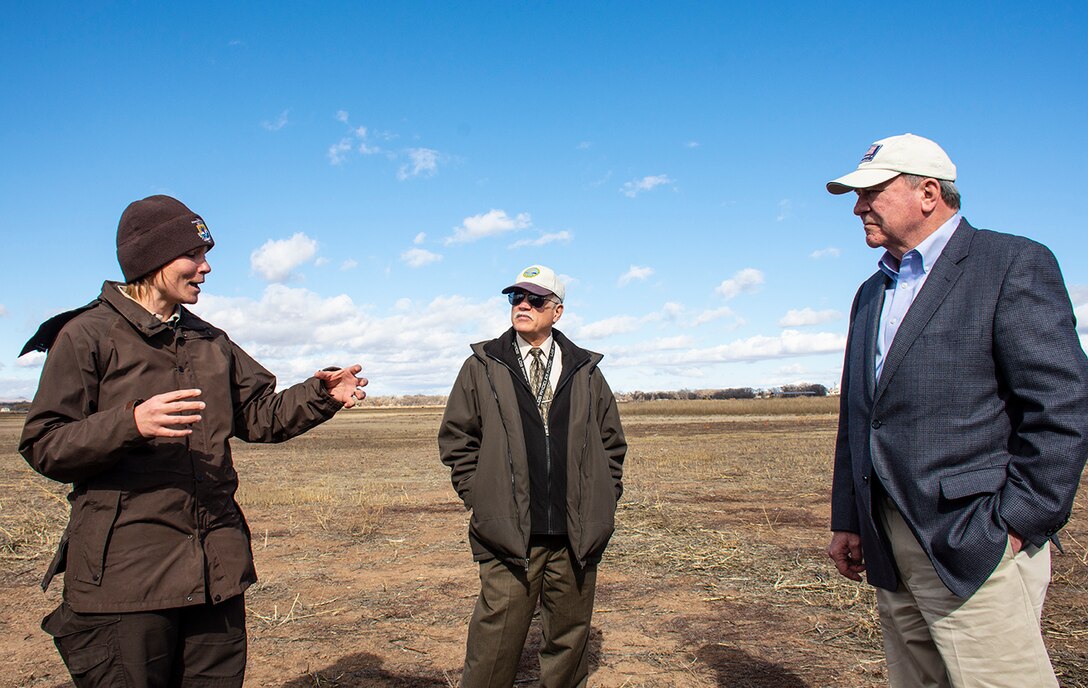 Albuquerque, N.M. -- Katie McVey, deputy refuge manager, Valle de Oro National Wildlife Refuge, briefs R.D James, assistant secretary of the Army for civil works, during his visit to U.S. Army Corps of Engineers-Albuquerque District Jan. 22.  The U.S. Bureau of Reclamation is working in partnership with U.S. Fish and Wildlife Service to establish functional wetlands for Clean Water Act, Sec. 404 compensatory mitigation, to offset adverse impacts from Reclamation projects at Valle de Oro National Wildlife Refuge.