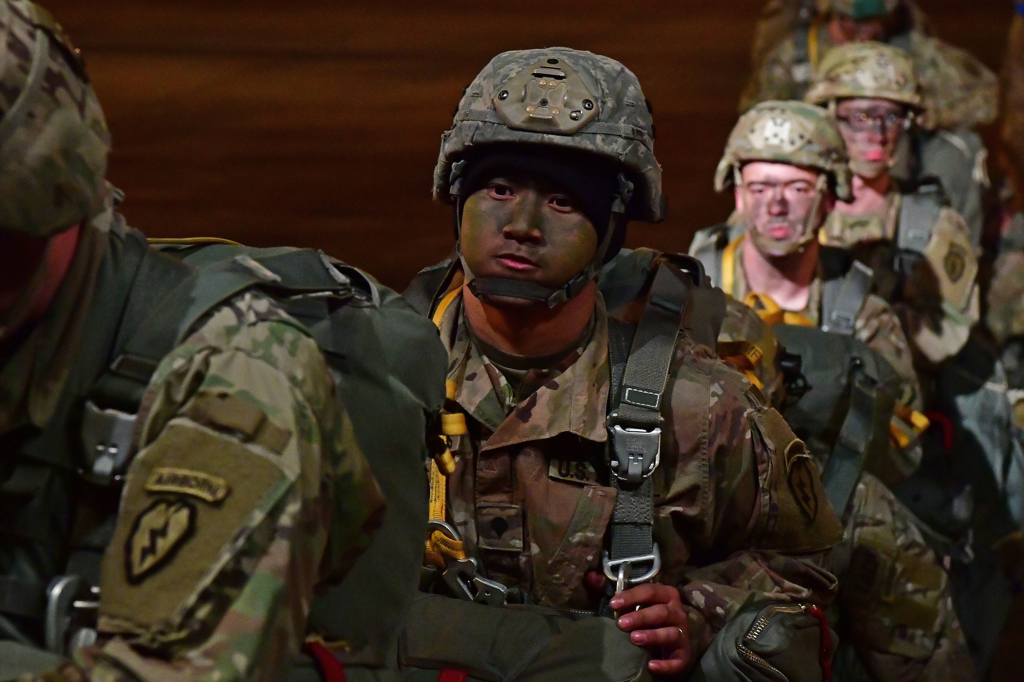 Soldiers from the 4th Brigade Combat Team (Airborne), 25th Infantry Division, at Joint Base Elmendorf-Richardson, Alaska, board a C-130J Super Hercules during the joint forcible entry and airborne assault.