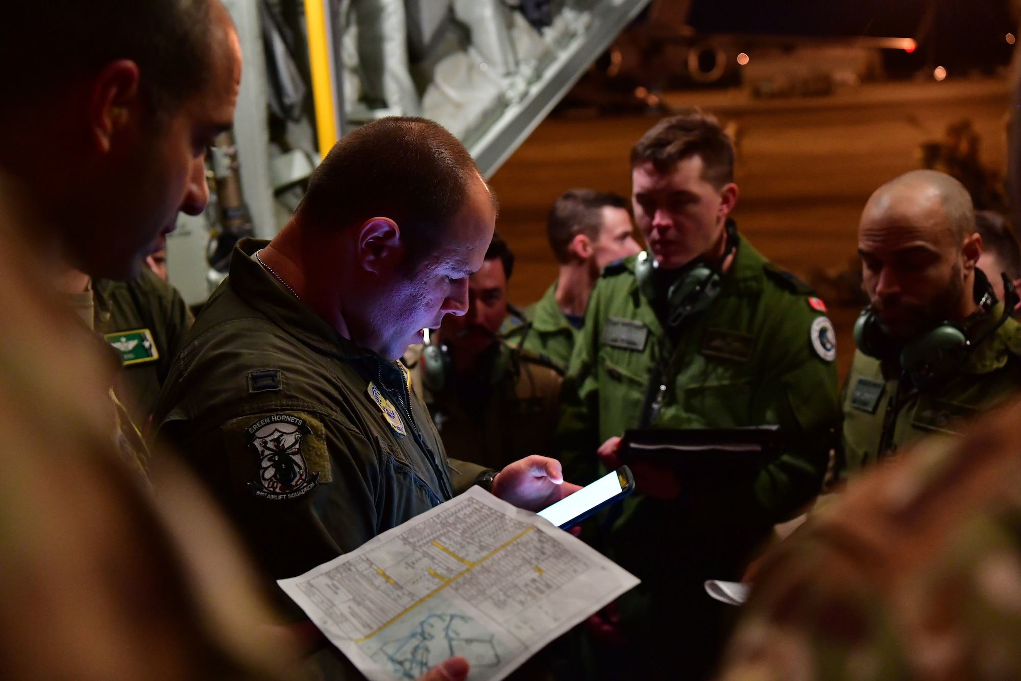 A pilot from the 61st Airlift Squadron gives a pre-flight mission brief on the back of a C-130J Super Hercules during the joint forcible entry and airborne assault which kicked off Green Flag Little Rock 20-03.