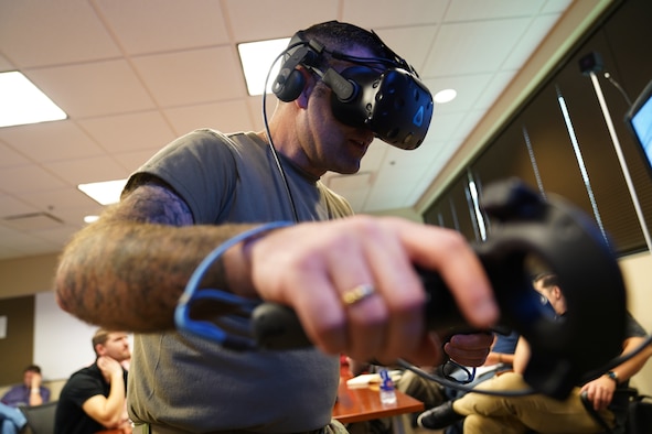 U.S. Air Force Master Sgt. Nathan Cyr, 335th Training Squadron Precision Measurement Equipment Laboratory career field training manager, tests new virtual reality technology inside the Trainer Development Center at Keesler Air Force Base, Mississippi, Jan. 16, 2020. The 335th TRS has introduced a new VR training experience to teach the students in the PMEL career field more efficiently. (U.S. Air Force photo by Airman 1st Class Seth Haddix)
