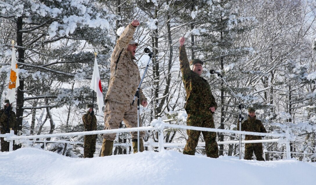 Col. Jason Perry (Left), the commanding officer of 4th Marine Regiment, 3rd Marine Division, and Maj. Gen. Kose, the commanding officer of 5th Brigade, Japan Ground Self-Defense Force, chant with the forces during an opening ceremony to start off exercise Northern Viper on Hokudaien Training Area, Hokkaido, Japan, Jan. 26, 2020. Northern Viper is a regularly scheduled training exercise that is designed to enhance the interoperability of the U.S. and Japan Alliance by allowing infantry units to maintain their lethality and proficiency in infantry and combined arms tactics. (U.S. Marine Corps Photo By Cpl. Cameron E. Parks)