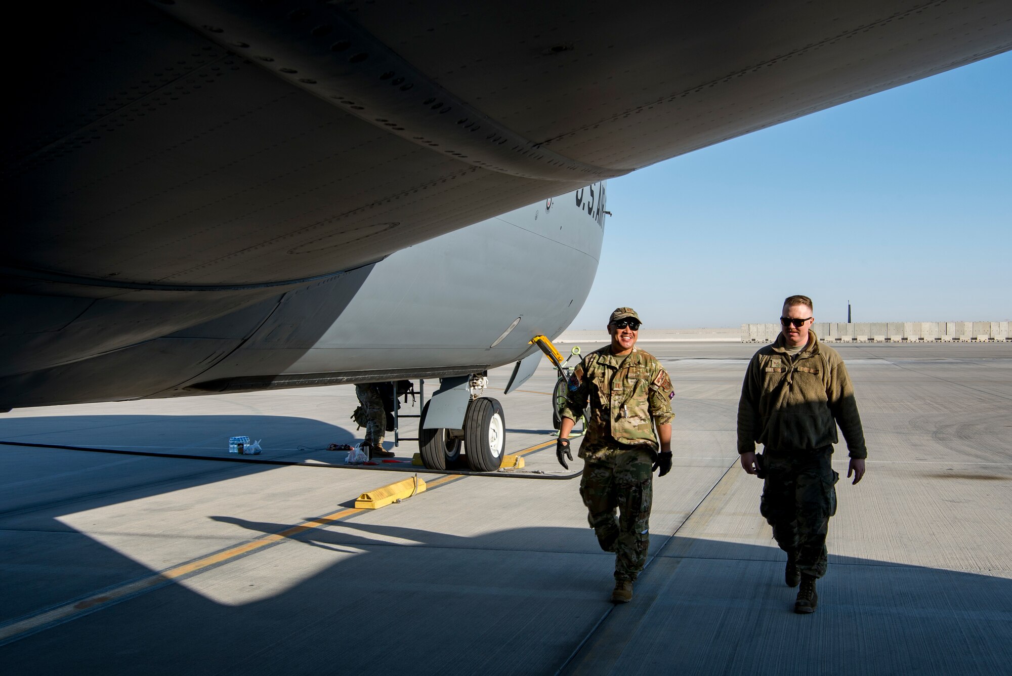 U.S. Air Force pilot assigned to the 28th Expeditionary Air Refueling Squadron, left, and a U.S. Air Force crew chief assigned to the 385th Expeditionary Aircraft Maintenance perform a preflight inspection on a KC-135 Stratotanker at Al Udeid Air Base, Qatar, Jan. 14, 2020.