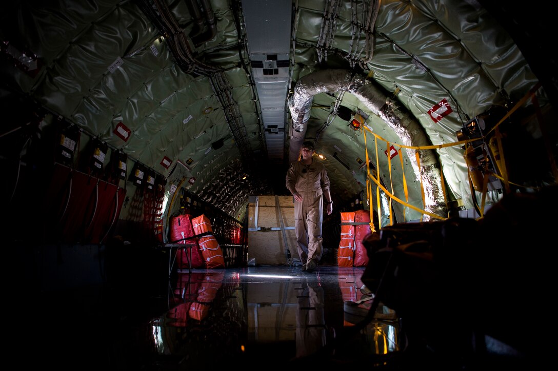 A U.S. Air Force in-flight refueling specialist assigned to the 28th Expeditionary Air Refueling Squadron performs a preflight inspection on a KC-135 Stratotanker at Al Udeid Air Base, Qatar, Jan. 14, 2020.