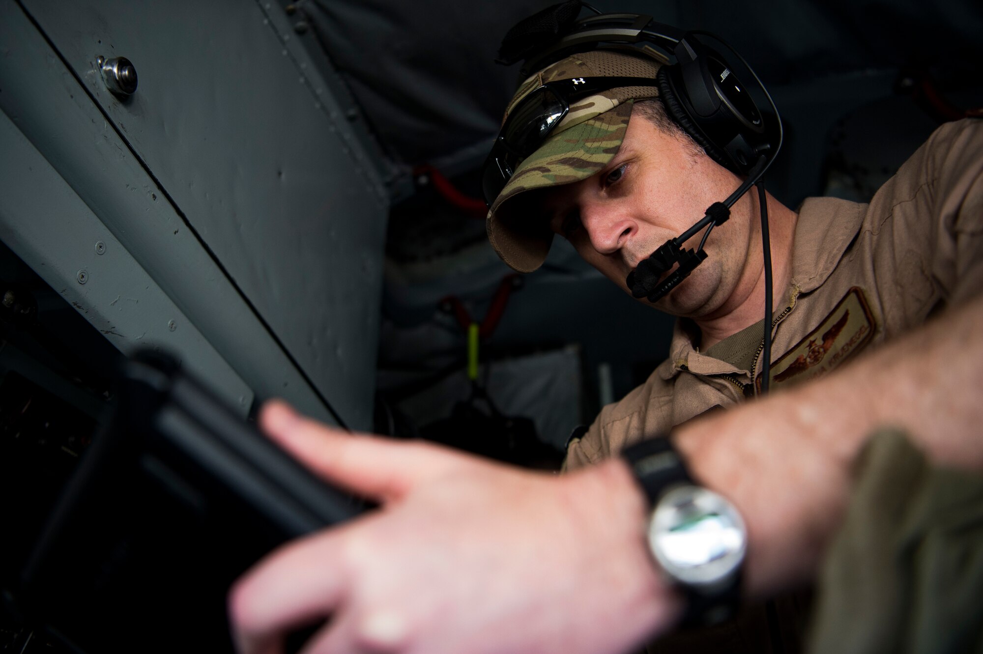 A U.S. Air Force in-flight refueling specialist assigned to the 28th Expeditionary Air Refueling Squadron performs a preflight inspection on a KC-135 Stratotanker at Al Udeid Air Base, Qatar, Jan. 14, 2020.