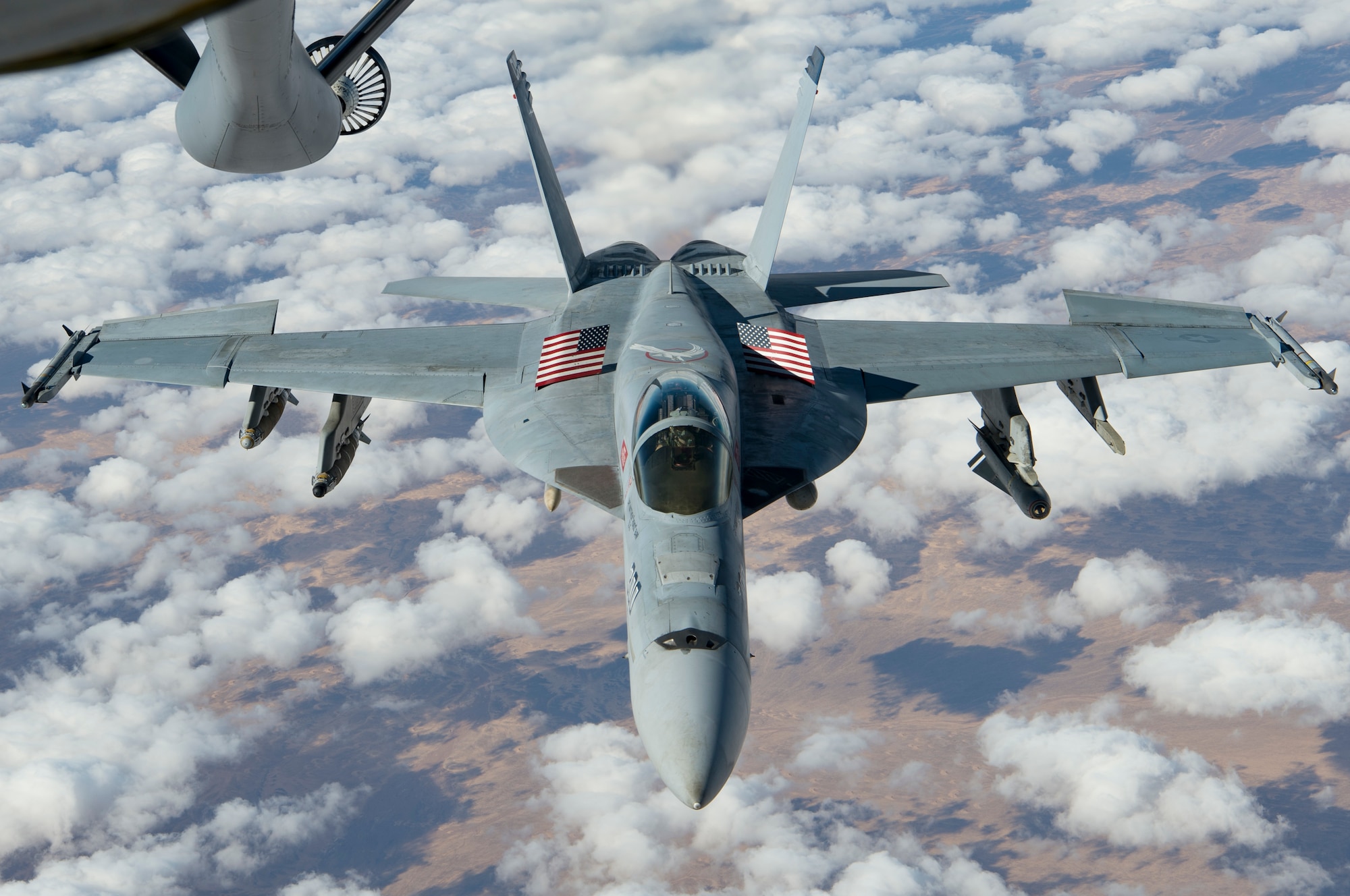 A U.S. Navy F/A-18 Super Hornet approaches a KC-135 Stratotanker assigned to the 28th Expeditionary Air Refueling Squadron to receive fuel over Afghanistan, Jan. 14, 2020.