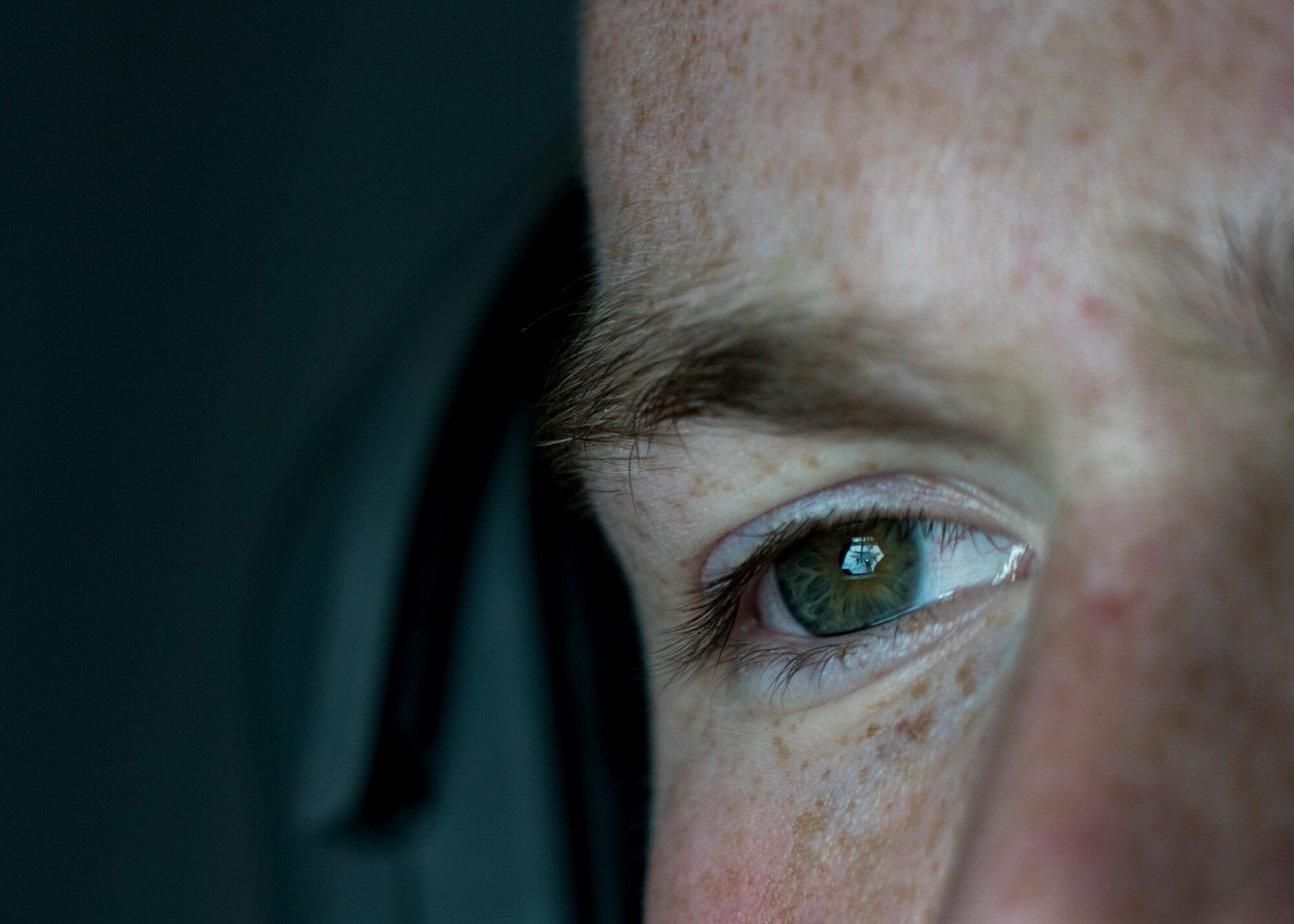 A U.S. Air Force boom operator assigned to the 908th Expeditionary Air Refueling Squadron watches an F-15E Strike Eagle aircraft from aboard a KC-10 Extender aircraft over an undisclosed location in support of Air Force Central Command objectives, Jan. 13, 2020.