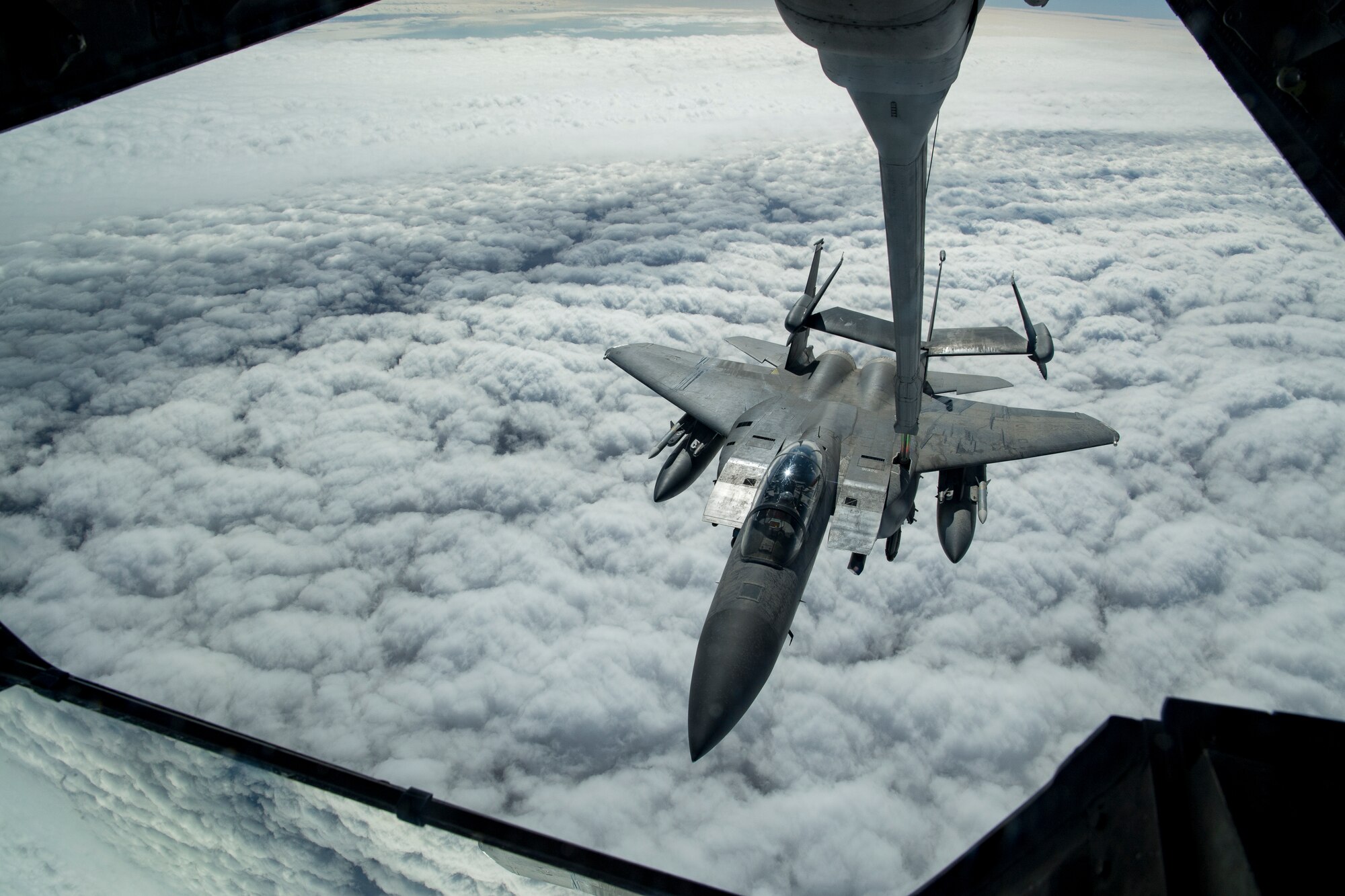 A U.S. Air Force F-15E Strike Eagle assigned to the 494th Expeditionary Fighter Squadron receives fuel from a U.S. Air Force KC-10 Extender assigned to the 908th Expeditionary Air Refueling Squadron above the U.S. Central Command area of responsibility, Jan. 13, 2020.