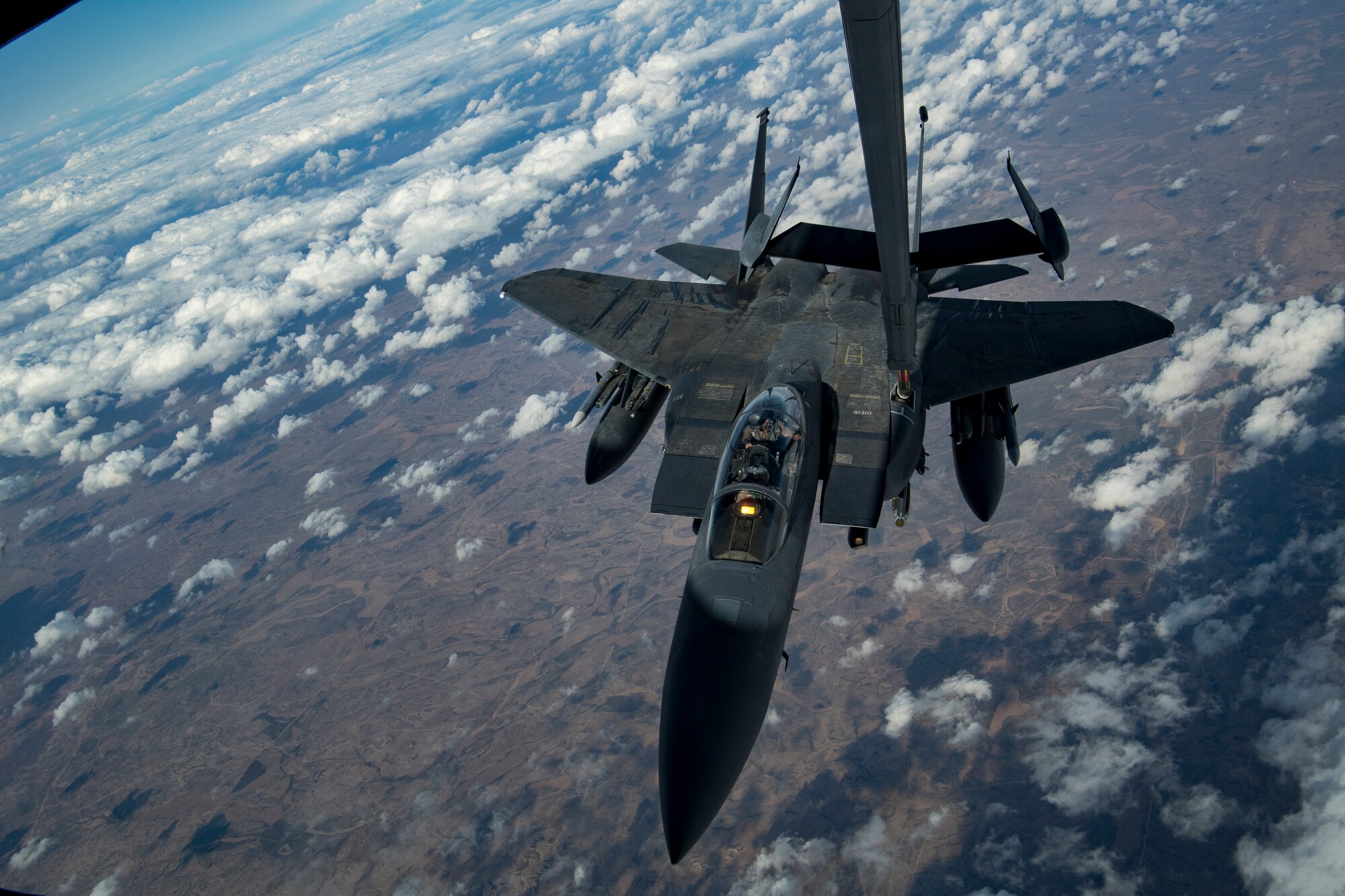 A U.S. Air Force F-15E Strike Eagle assigned to the 494th Expeditionary Fighter Squadron receives fuel from a U.S. Air Force KC-10 Extender assigned to the 908th Expeditionary Air Refueling Squadron above the U.S. Central Command area of responsibility, Jan. 13, 2020.