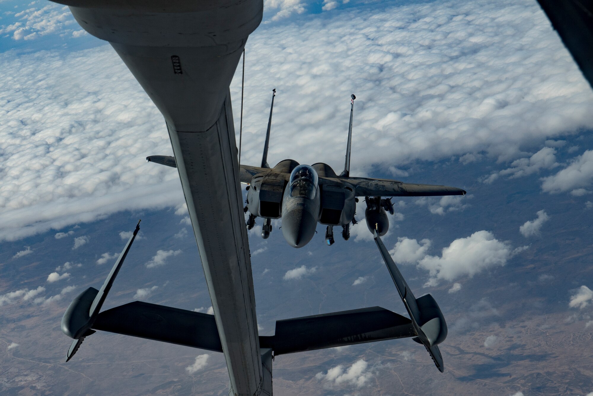 A U.S. Air Force F-15E Strike Eagle assigned to the 494th Expeditionary Fighter Squadron approaches a KC-10 Extender assigned to the 908th Expeditionary Air Refueling Squadron above the U.S. Central Command area of responsibility, Jan. 13, 2020.