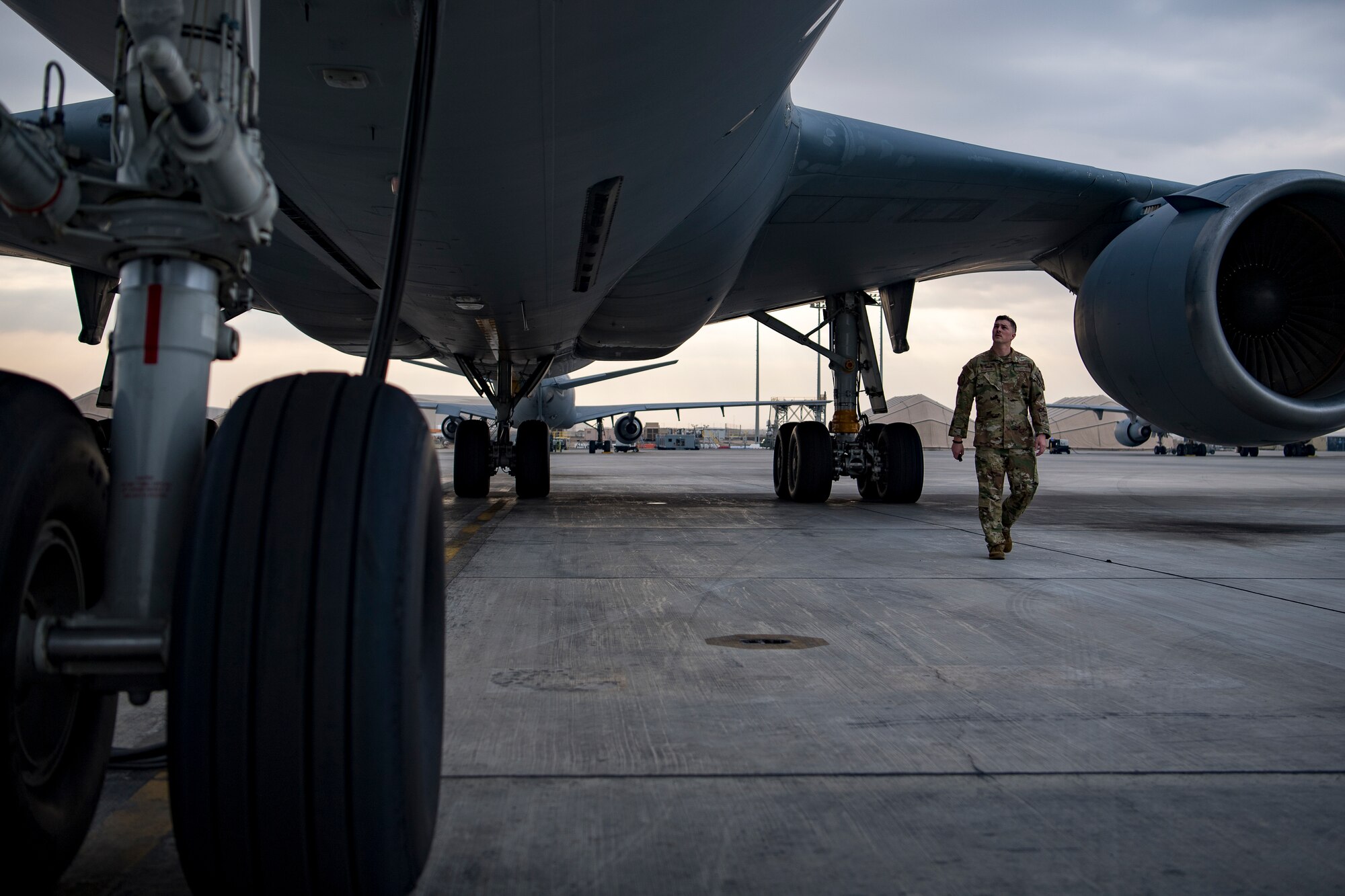 A U.S. Air Force flight engineer assigned to the 908th Expeditionary Air Refueling Squadron conducts preflight checks on a KC-10 Extender at Al Dhafra Air Base, United Arab Emirates, Jan. 13, 2020.