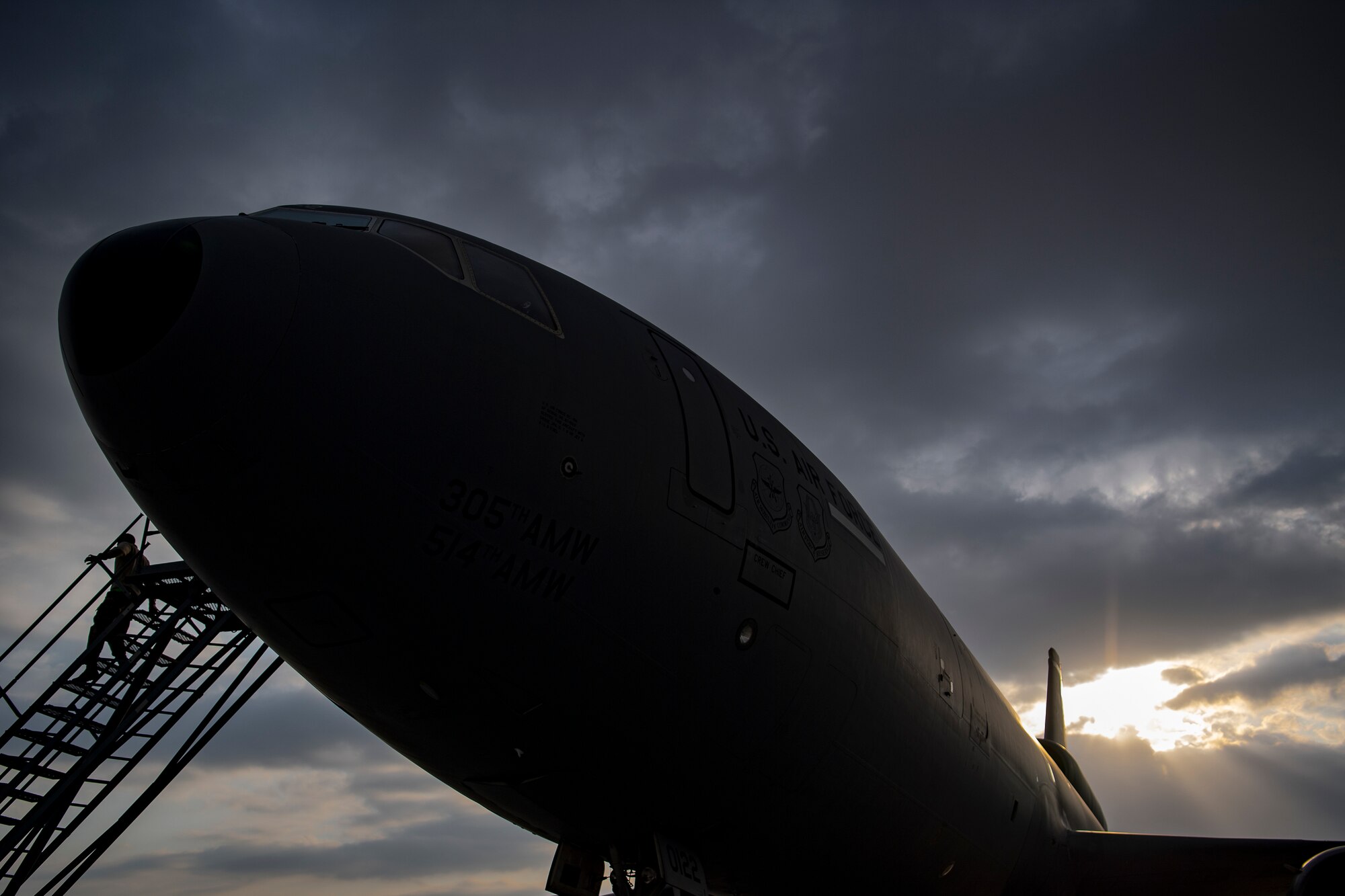 U.S. Air Force aircrew members assigned to the 908th Expeditionary Air Refueling Squadron conduct preflight checks on a KC-10 Extender at Al Dhafra Air Base, United Arab Emirates, Jan. 13, 2020.