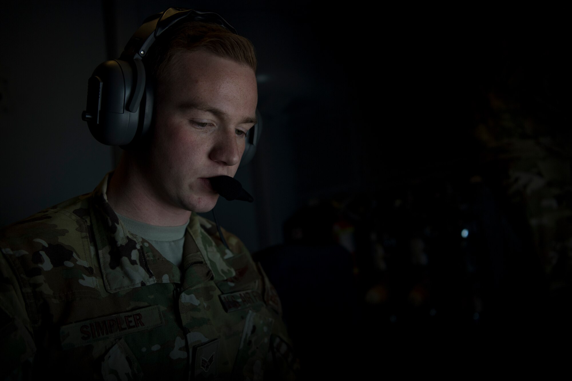 A U.S. Air Force KC-10 Extender in-flight refueling specialist assigned to the 908th Expeditionary Air Refueling Squadron, deployed to Al Dhafra Air Base, United Arab Emirates, conducts an aerial refueling above the U.S. Central Command area of responsibility, Jan. 13, 2020.