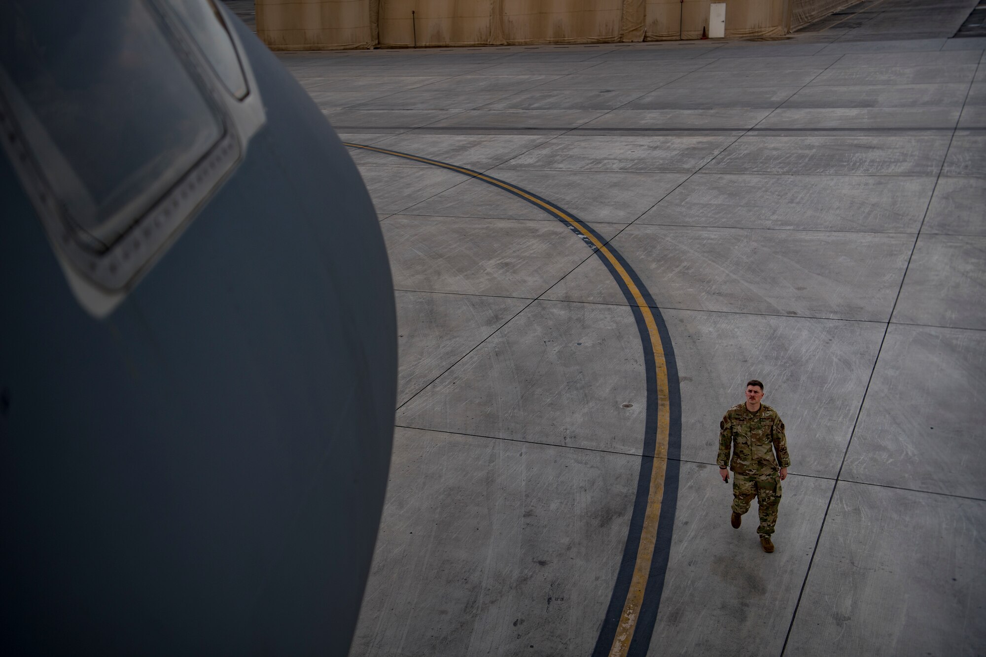 A U.S. Air Force flight engineer assigned to the 908th Expeditionary Air Refueling Squadron conducts preflight checks on a KC-10 Extender at Al Dhafra Air Base, United Arab Emirates Jan. 13, 2020.