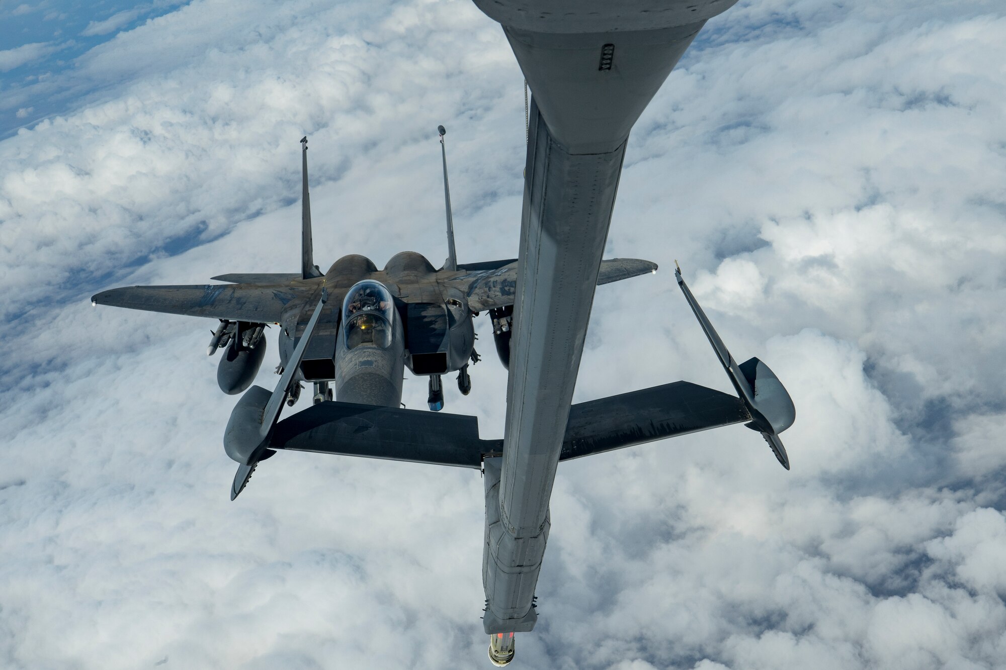 A U.S. Air Force F-15E Strike Eagle assigned to the 494th Expeditionary Fighter Squadron approaches the boom of a KC-10 Extender assigned to the 908th Expeditionary Air Refueling Squadron above the U.S. Central Command area of responsibility, Jan. 13, 2020.