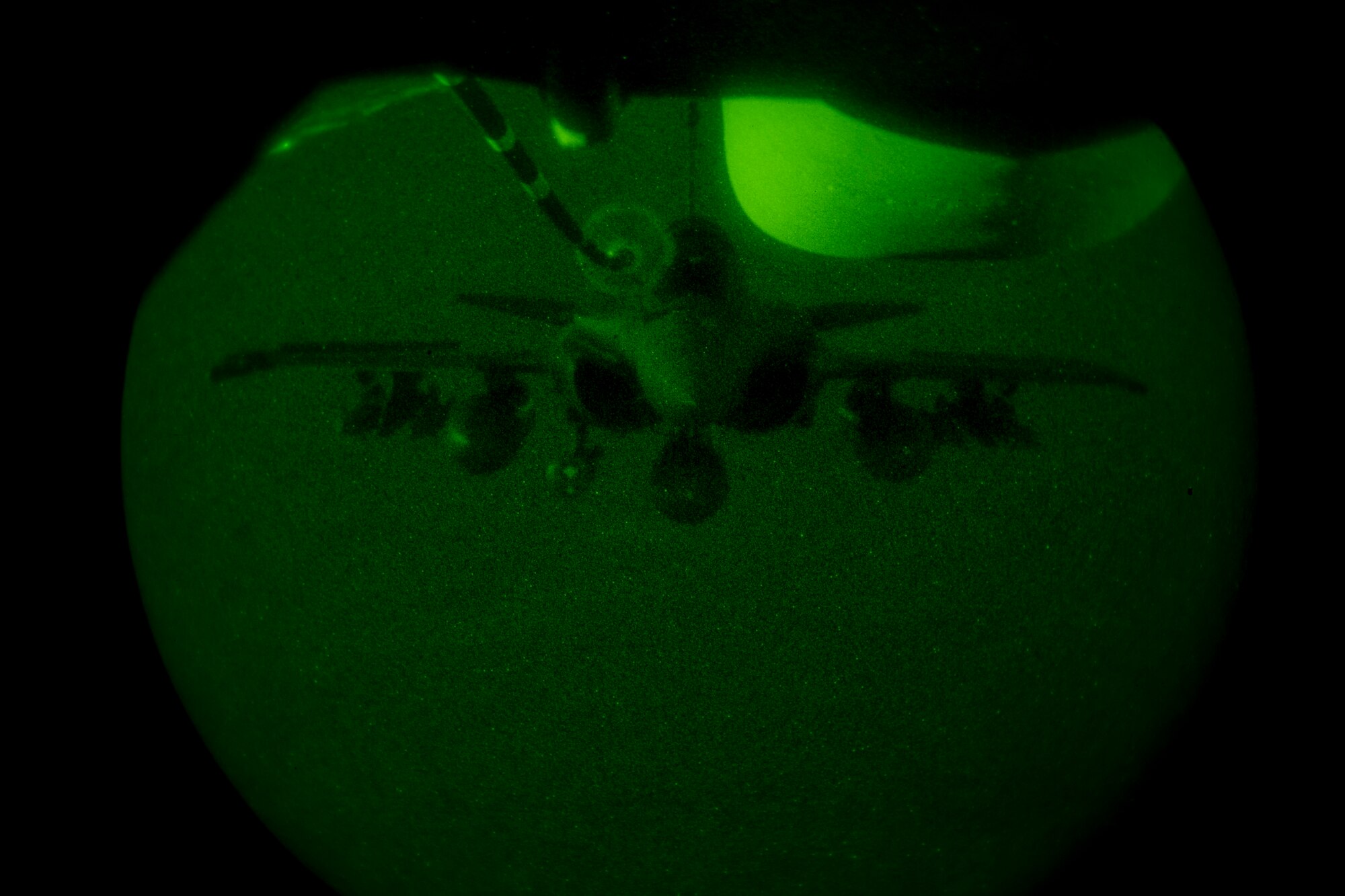 A U.S. Air Force KC-10 Extender boom operator with the 908th Expeditionary Air Refueling Squadron conducts an aerial refueling with a French Air Force Dassault Rafale fighter aircraft in support of Operation Inherent Resolve, Jan. 11, 2020.