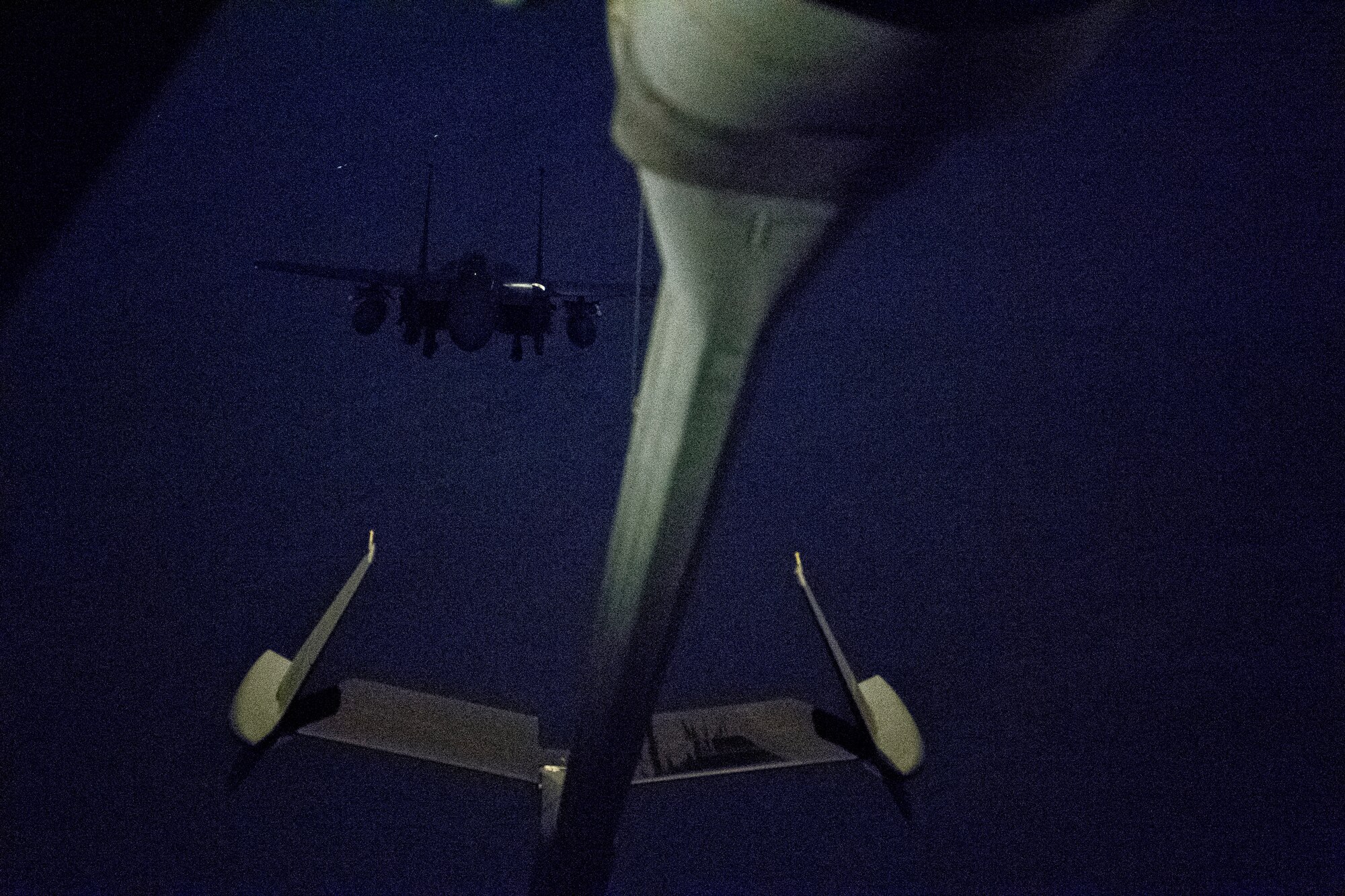 A U.S. Air Force F-15E Strike Eagle assigned to the 494th Expeditionary Fighter Squadron approaches the boom of a U.S. Air Force KC-10 Extender assigned to the 908th Expeditionary Air Refueling Squadron above the U.S. Central Command area of responsibility, Jan. 11, 2020.
