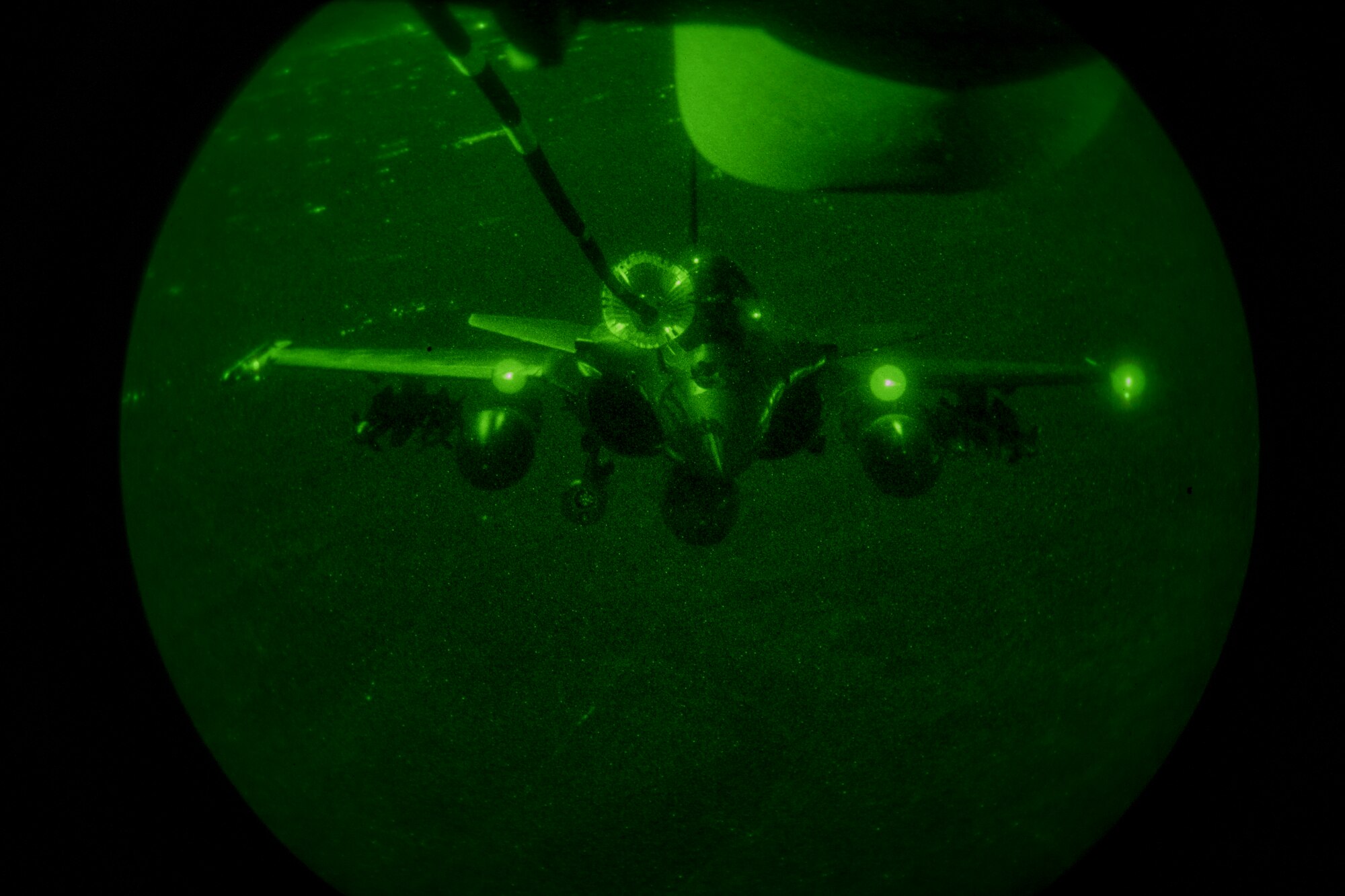 A U.S. Air Force KC-10 Extender boom operator with the 908th Expeditionary Air Refueling Squadron conducts an aerial refueling with a French Air Force Dassault Rafale fighter aircraft in support of Operation Inherent Resolve, Jan. 11, 2020.