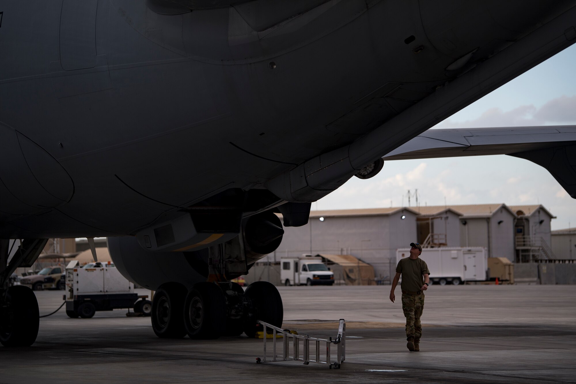 A U.S. Air Force KC-10 Extender flight engineer assigned to the 908th Expeditionary Air Refueling Squadron conducts preflight checks at Al Dhafra Air Base, United Arab Emirates, Jan. 11, 2020.