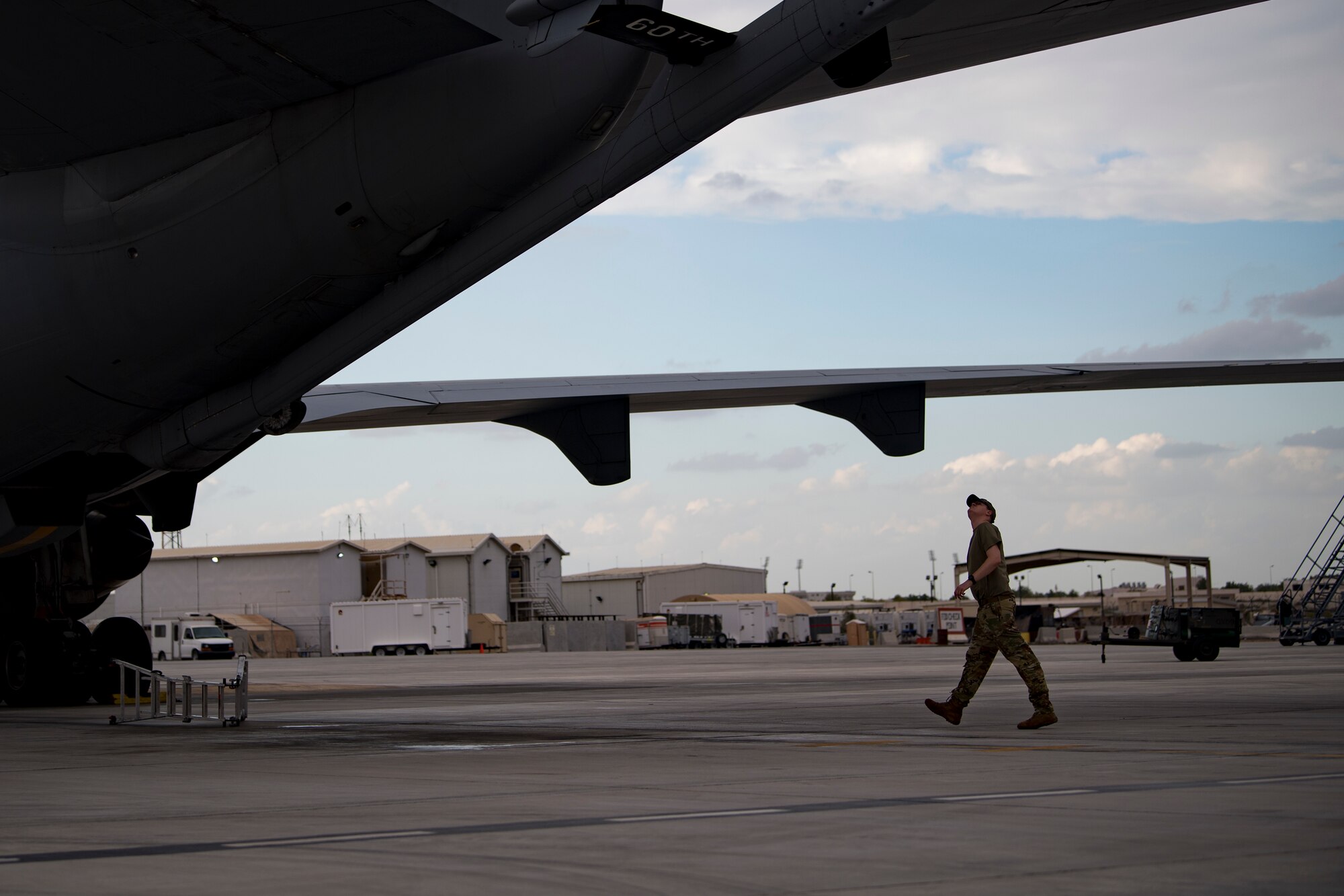 A U.S. Air Force KC-10 Extender flight engineer assigned to the 908th Expeditionary Air Refueling Squadron conducts preflight checks at Al Dhafra Air Base, United Arab Emirates, Jan. 11, 2020.