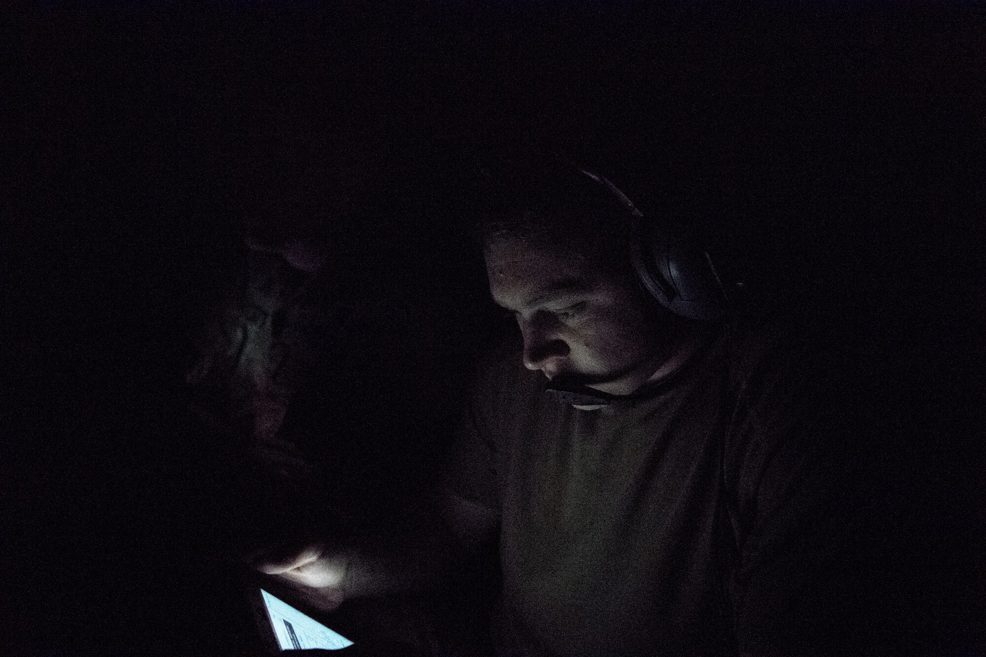 A U.S. Air Force KC-10 Extender boom operator assigned to the 908th Expeditionary Air Refueling Squadron reviews technical data above the U.S. Central Command area of responsibility, Jan. 11, 2020. The 908th EARS, deployed with U.S. Air Forces Central Comm