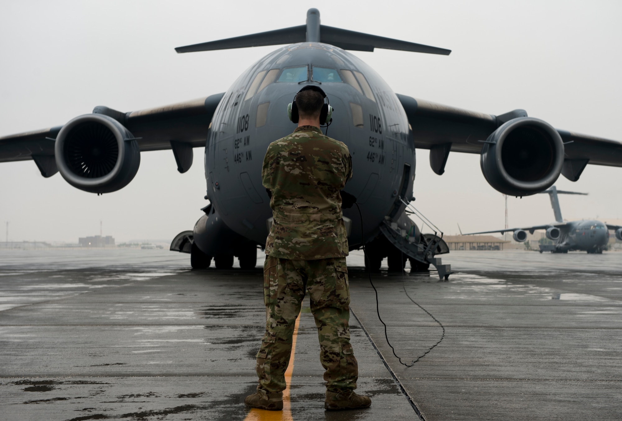 A U.S. Air Force C-17 Globemaster III loadmaster assigned to the 816th Expeditionary Airlift Squadron performs engine start checks at Al Udeid Air Base, Qatar, Jan. 10, 2020.