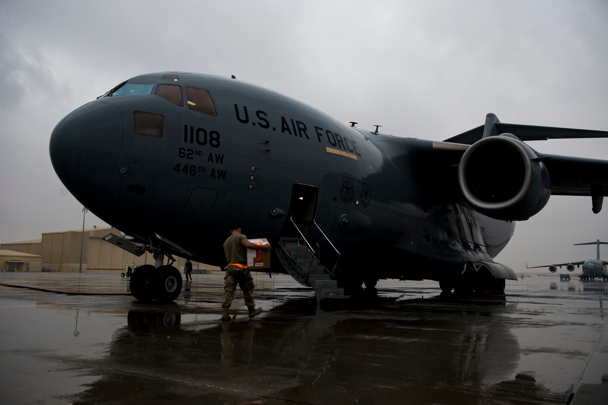 A U.S. Air Force aerial porter assigned to the 746th Expeditionary Logistics Readiness Squadron loads cargo on to a C-17 Globemaster III at Al Udeid Air Base, Qatar, Jan. 10, 2020.