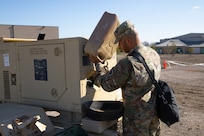 Army Spc. Jordan Gomes, assigned to the 63rd Expeditionary Signal Battalion, refuels a portable generator during Exercise Sudden Response (SR) 20.