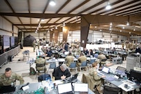 Members of the Joint Task Force Civil Support (JTF-CS) Joint Operations Center (JOC) listen to N+2 hour brief as part of Exercise Sudden Response (SR) 20.