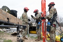 Service members assigned to 3rd Platoon 68th Engineer Company urban rescue team prepare to conduct a simulated confined-space rescue as part of Exercise Sudden Response (SR) 20.