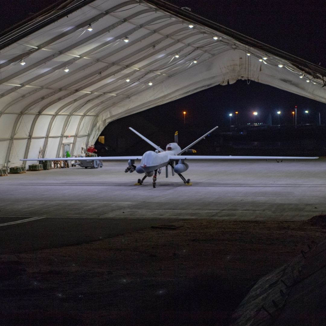 A U.S. Air Force MQ-9 Reaper remotely piloted aircraft equipped with external fuel tanks and armed with munitions sits in a hanger prior to Intelligence, Surveillance, and Reconnaissance operations at Ali Al Salem Air Base, Kuwait, July 23, 2019.