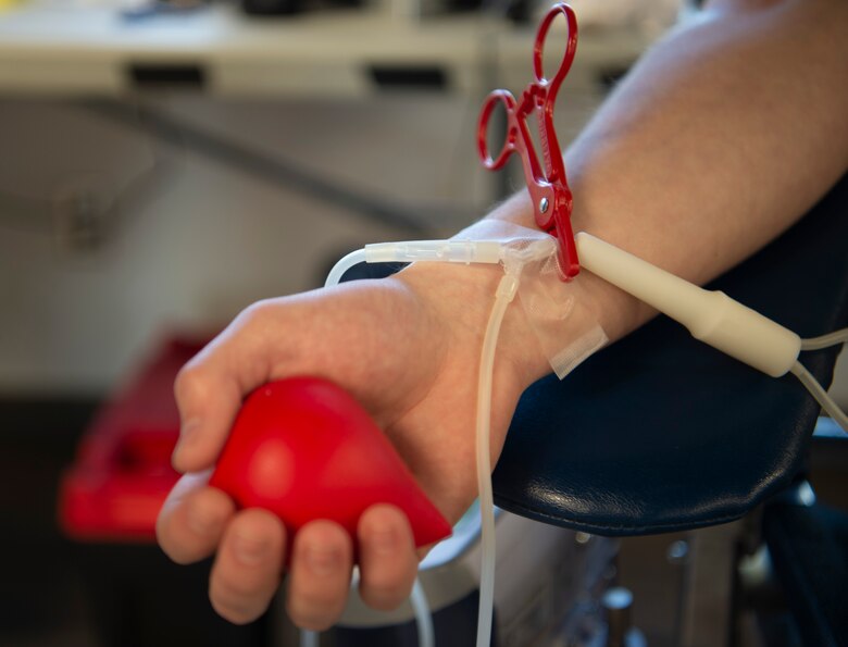 A member of Team Schriever squeezes a stress ball during a blood drive to increase the flow of blood at Schriever Air Force Base, Colorado, Jan. 24, 2020. Vitalant, the company drawing blood, will donate the collected pints to multiple hospitals in Colorado. (U.S. Air Force photo by Airman 1st Class Jonathan Whitely)