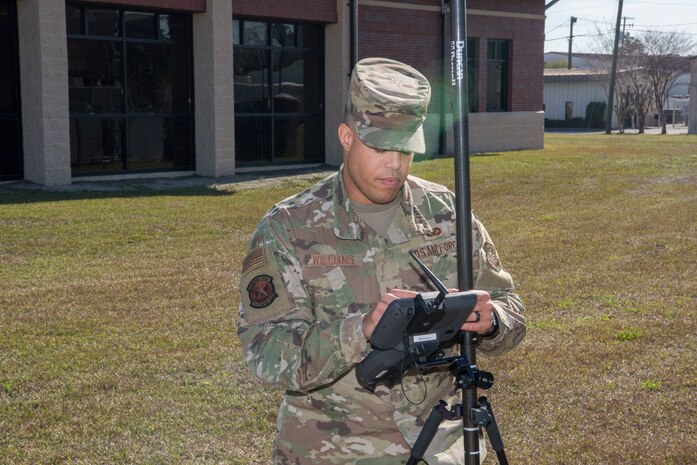 Staff Sgt. Aaron Williams, team lead for the 628th Civil Engineering Squadron’s Weapons Station geo-integrations office, tests a global navigation system receiver