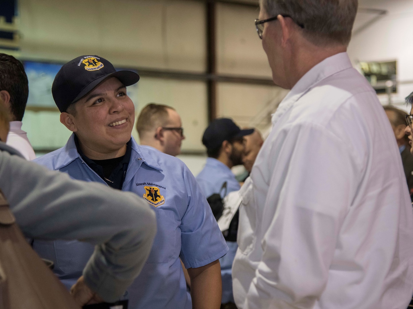 Lincoln Sundman, 12th Maintenance Group T-1/T-6 Aircraft Maintenance Unit branch chief, Joint Base San Antonio-Randolph talks with Roxanne Romero, one of the seven new hires for the 12th MXG at the Hallmark University College of Aeronautics graduation ceremony Jan. 23, 2020. These hires were a direct result of the 12th MXG’s push for recruitment and new employees for the upcoming missions slated for JBSA-Randolph.