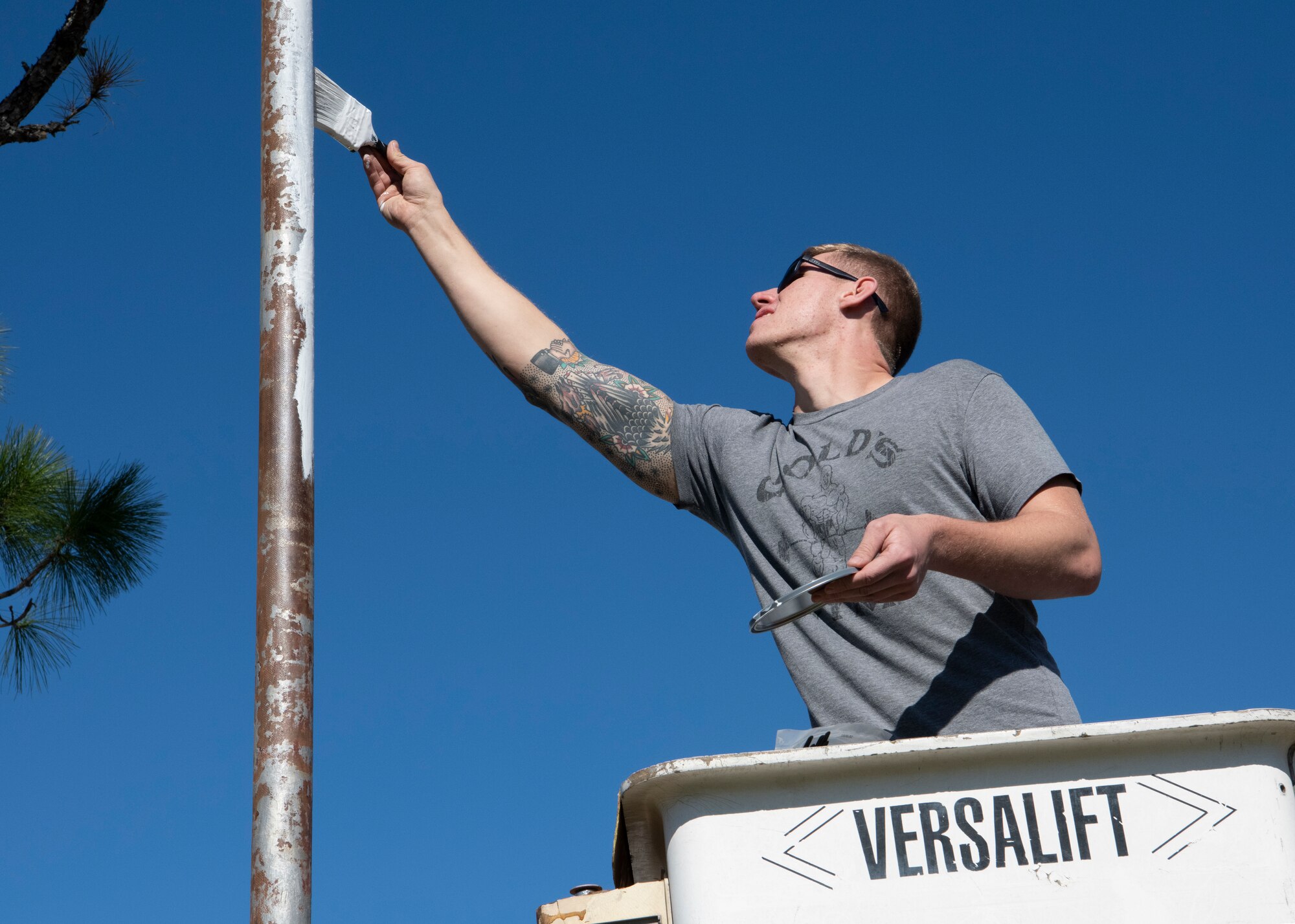 United States Air Force Staff Sgt. Erich Olsen, 325th Maintenance Squadron, low observable maintainer, applies primer to the top of a flag pole, Panama City, Florida, Jan. 25, 2020. Olsen and his fellow airmen used their skills from painting fighter jets to restore the St. Andrew School flag pole that became rusted over after Hurricane Michael.