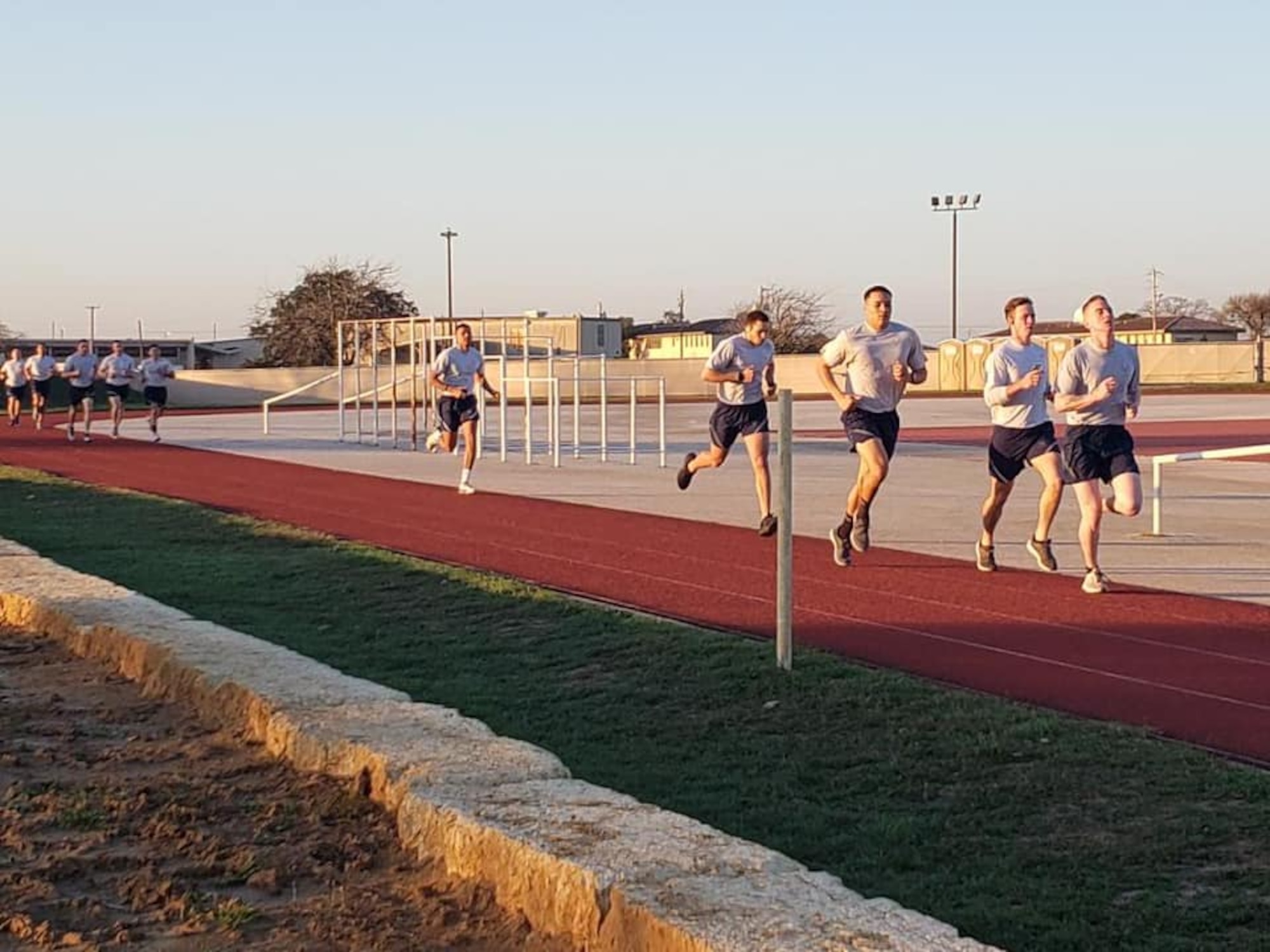 Security Forces Airmen take part in the run portion of a physical fitness test as the opening day of the Air Education and Training Command Defender Challenge team tryout at Joint Base San Antonio-Lackland, Texas, Jan. 27, 2020. The five-day selection camp includes a physical fitness test, M-9 and M-4 weapons firing, the alpha warrior obstacle course, a ruck march and also includes a military working dog tryout as well.