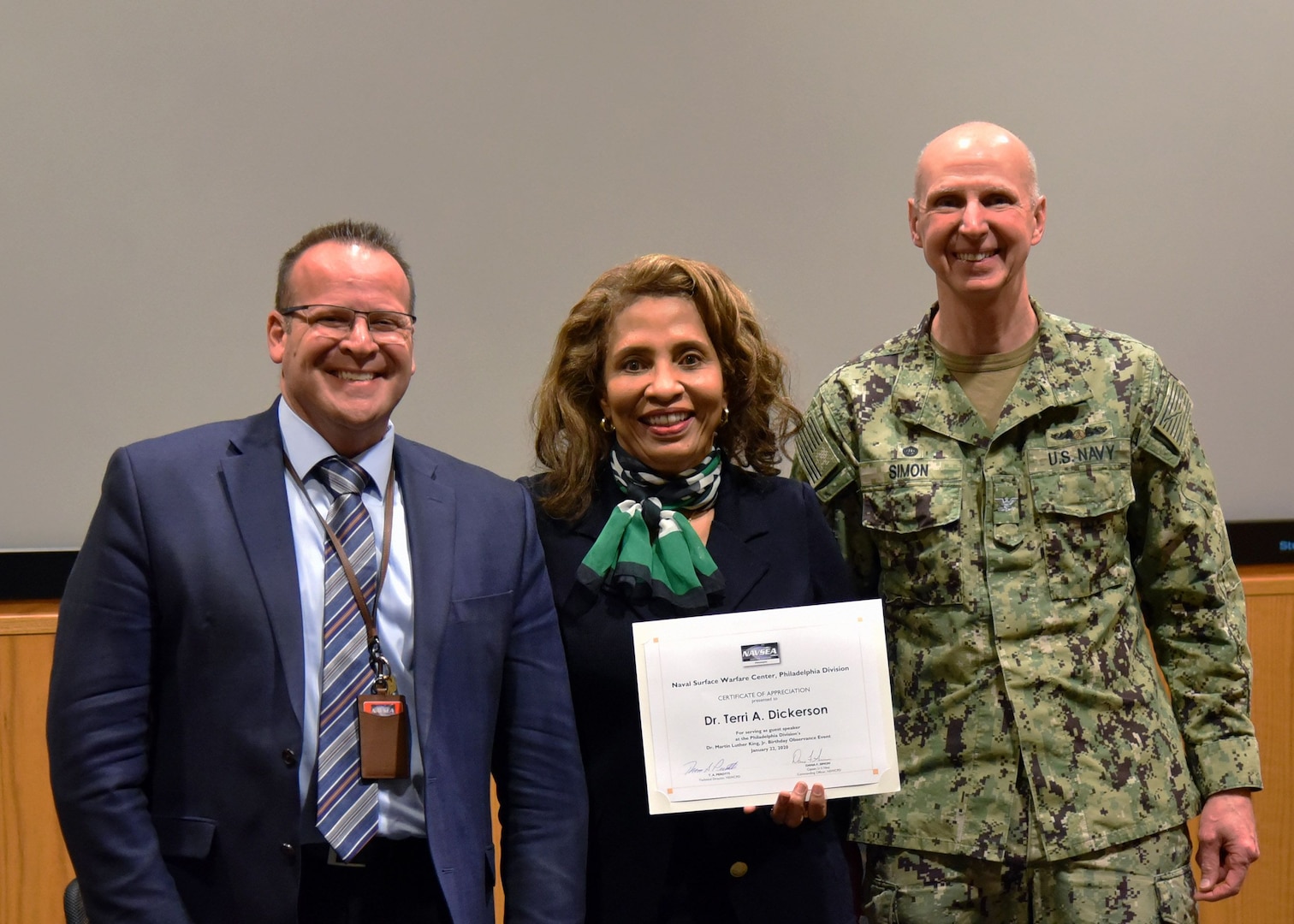 Naval Surface Warfare Center, Philadelphia Division (NSWCPD) Commanding Officer Capt. Dana Simon (right) and Technical Director Tom Perotti (left) presented Dr. Terri A. Dickerson, Director, Civil Rights Directorate, U.S. Coast Guard, with a certificate of appreciation following her remarks at NSWCPD’s Dr. Martin Luther King Jr. Birthday Observance on Jan. 22. Dickerson shared her story from being a member of the first class to integrate the New Orleans Catholic school system to a member of the Senior Executive Service (SES). (U.S. Navy Photo by Kirsten. St. Peter/Released)