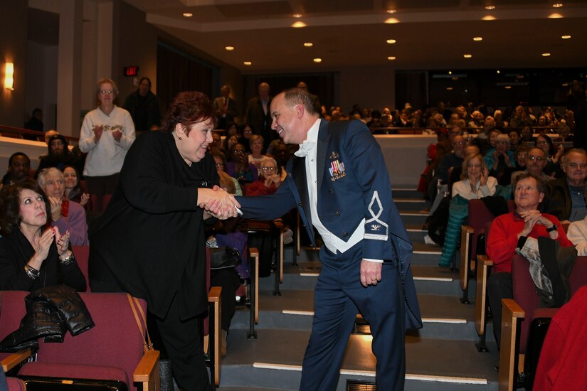 Col. Don Schofield, U.S. Air Force Band commander and conductor, shakes hands with a show attendee during a Guest Concert Series performance at the Rachel M. Schlesinger Concert Hall and Arts Center in Alexandria, Va., Jan. 23, 2020. The concert featured the U.S. Air Force Concert Band and their guest performer, Aaron Diehl. (U.S. Air Force photo by Airman 1st Class Spencer Slocum)