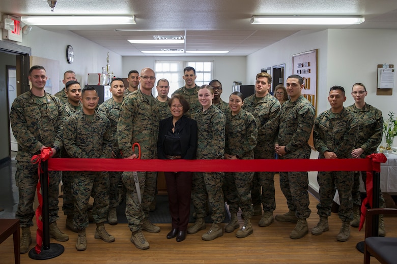 Marine Corps Air Station Yuma Commanding Officer, Col. David Suggs, alongside the legal center personnel, cuts the ribbon in honor of the official opening of the station tax center aboard MCAS Yuma, Ariz., Jan. 15, 2020. (U.S. Marine Corps photo by Lance Cpl John Hall)